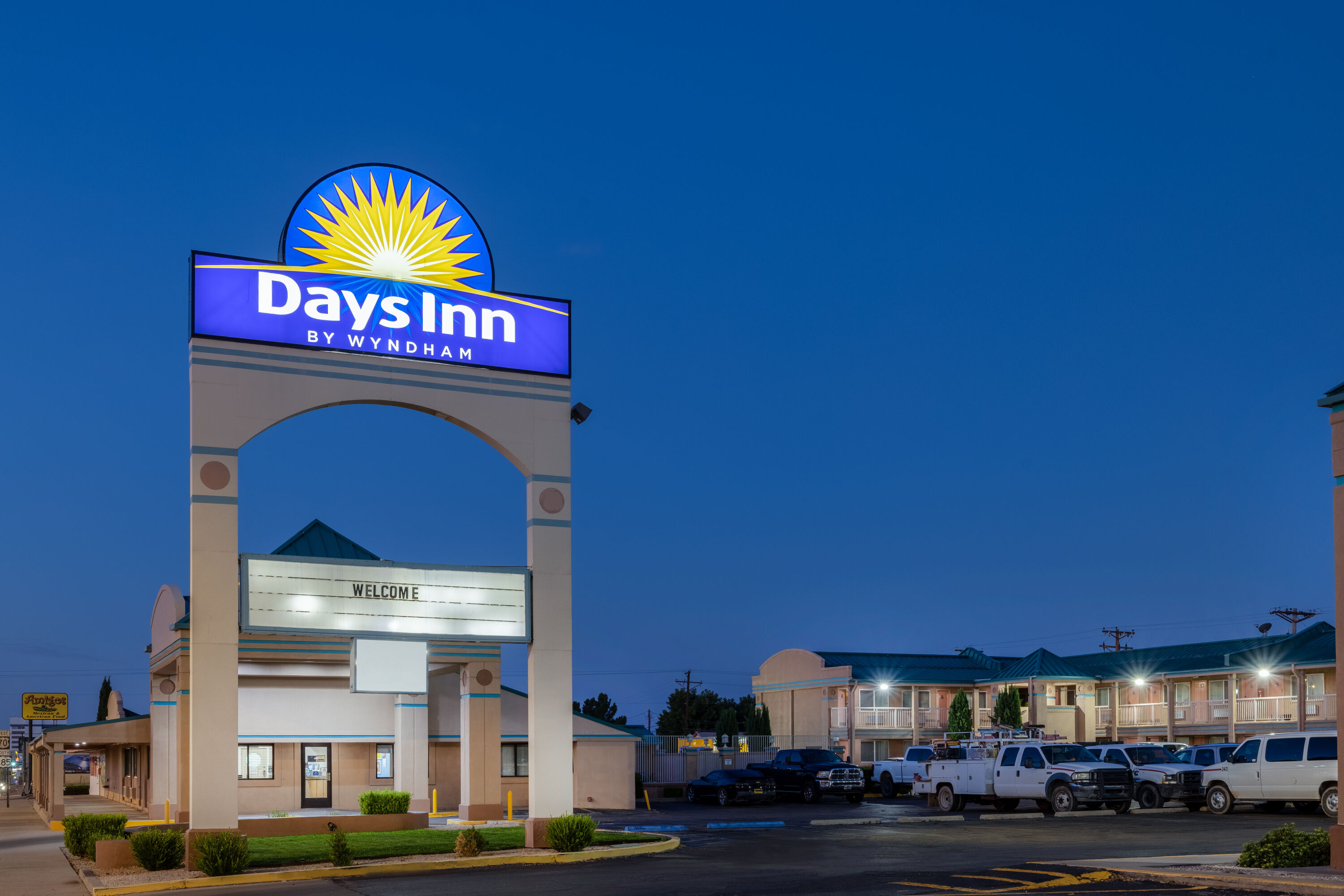 Exterior Dusk Image of Days Inn by Wyndham Roswell hotel in Roswell, New Mexico