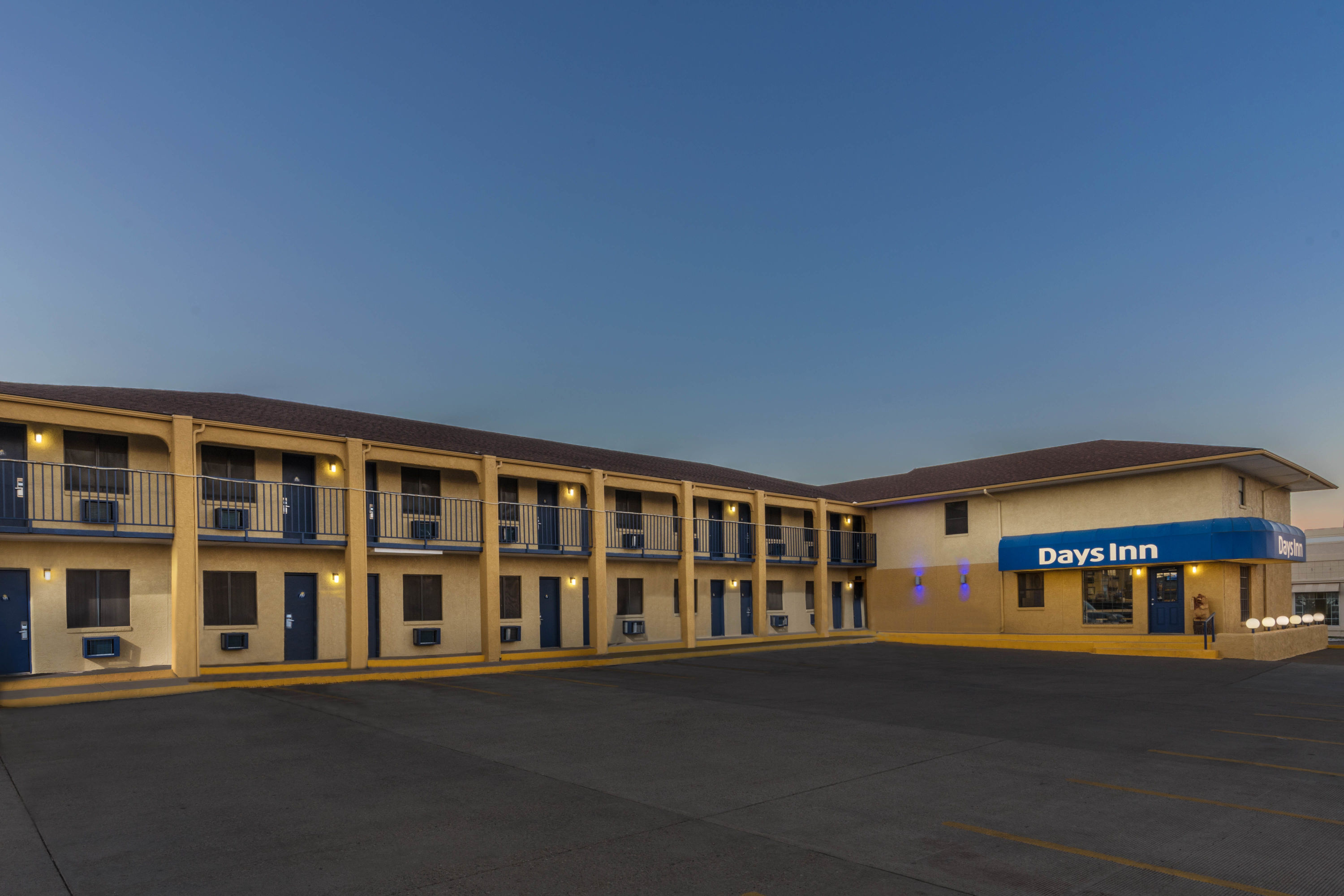 Exterior Dusk Image of Days Inn by Wyndham Tucumcari hotel in Tucumcari, New Mexico