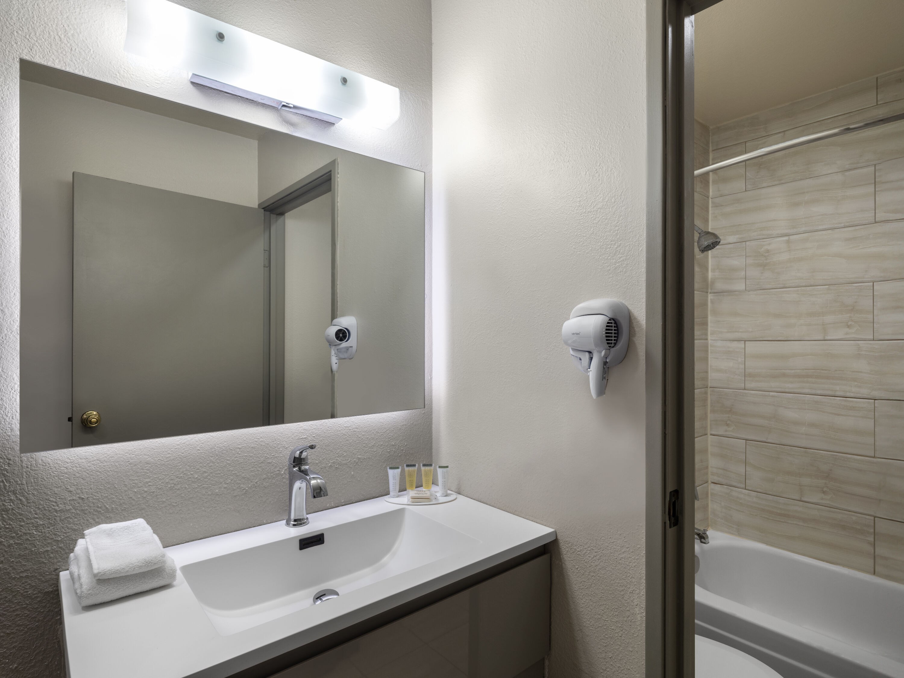 Guest room bath at the Days Inn by Wyndham Las Vegas Airport Near the Strip in Las Vegas, Nevada