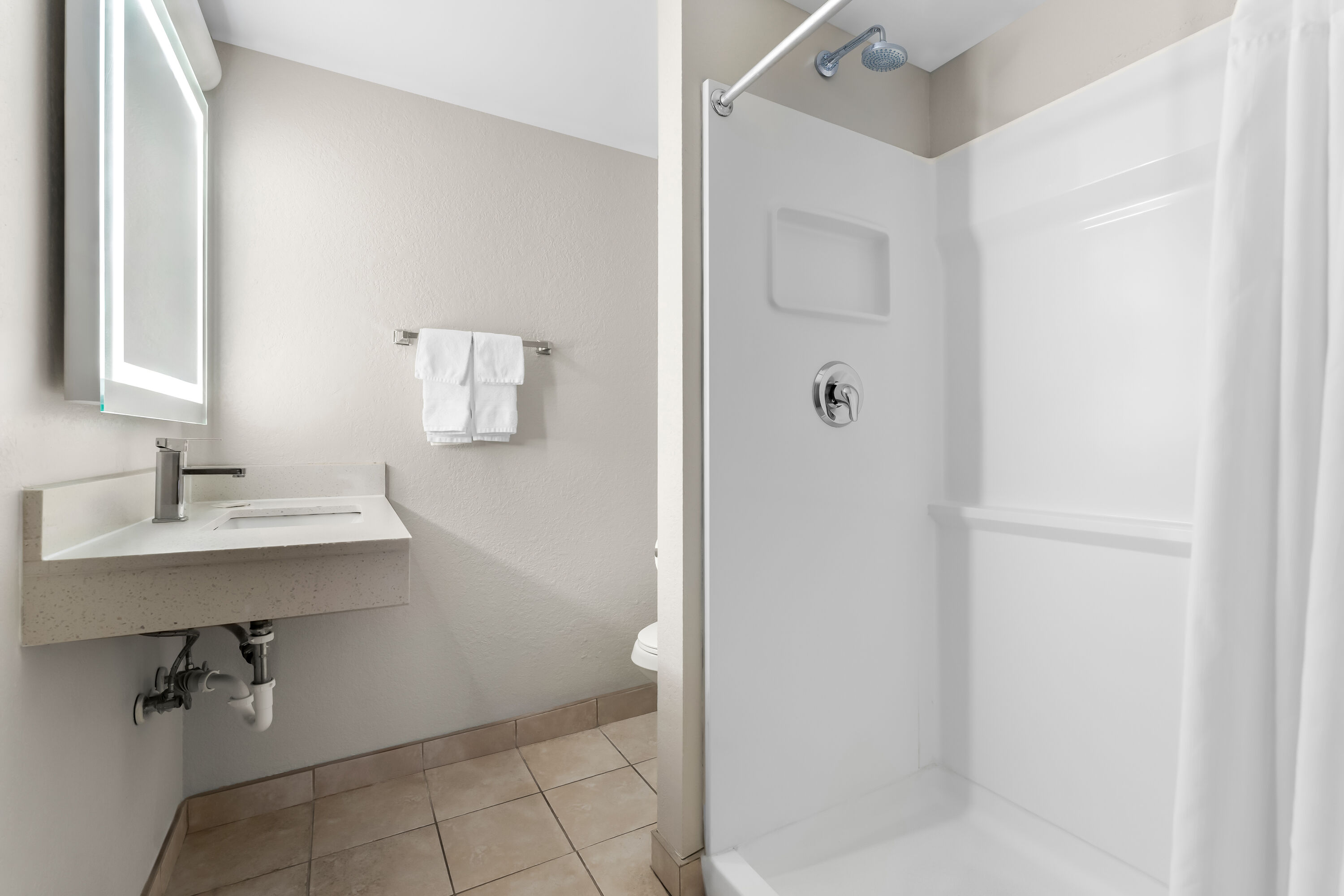 Guest room bath at the Days Inn by Wyndham Albany SUNY in Albany, New York