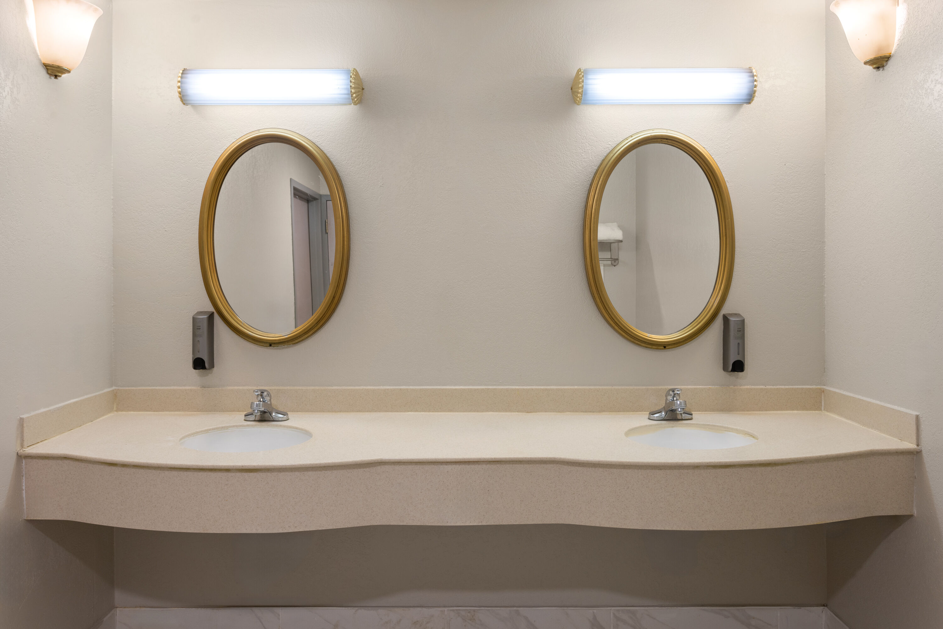 Guest room bath at the Days Inn & Suites by Wyndham Albany in Albany, New York