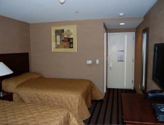 Guest room at the Days Inn by Wyndham Bronx Near Stadium in Bronx, New York