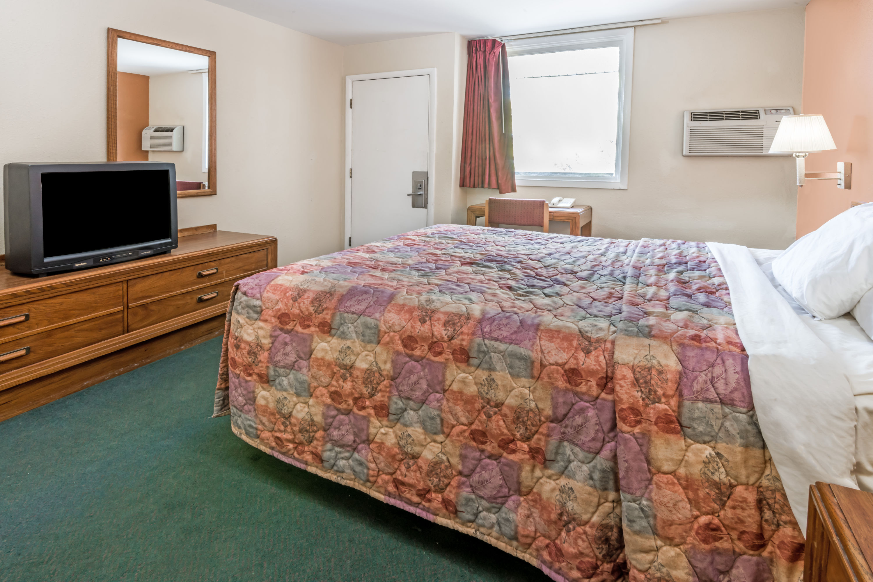 Guest room at the Days Inn by Wyndham Henrietta/Rochester Area in Henrietta, New York
