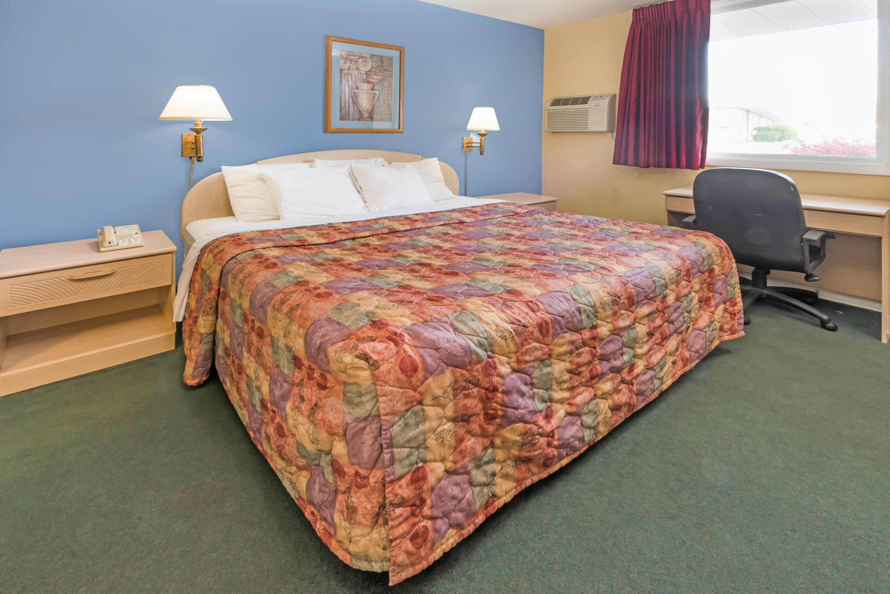 Guest room at the Days Inn by Wyndham Henrietta/Rochester Area in Henrietta, New York