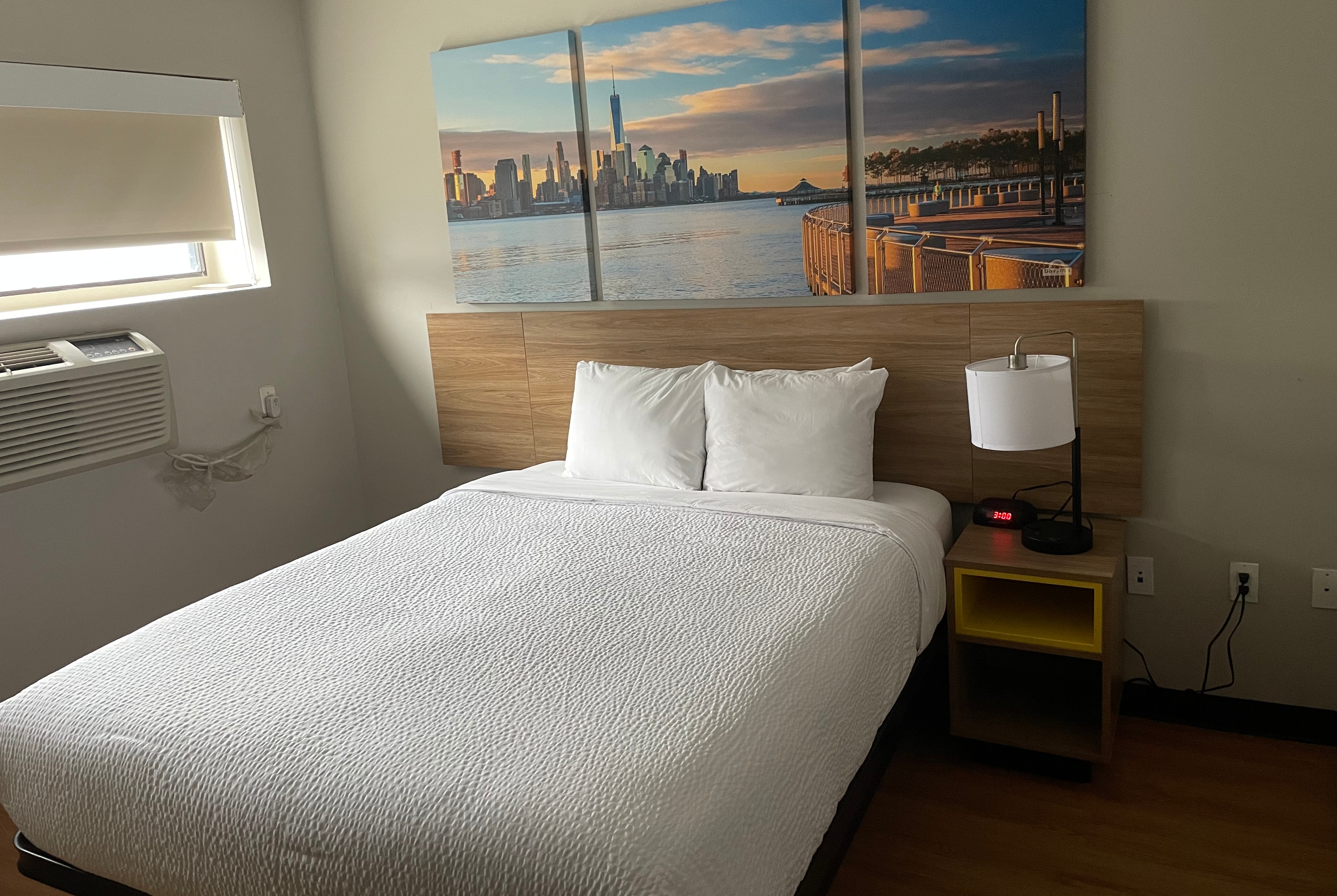 Guest room at the Days Inn & Suites by Wyndham Jamaica JFK Airport in Jamaica, New York