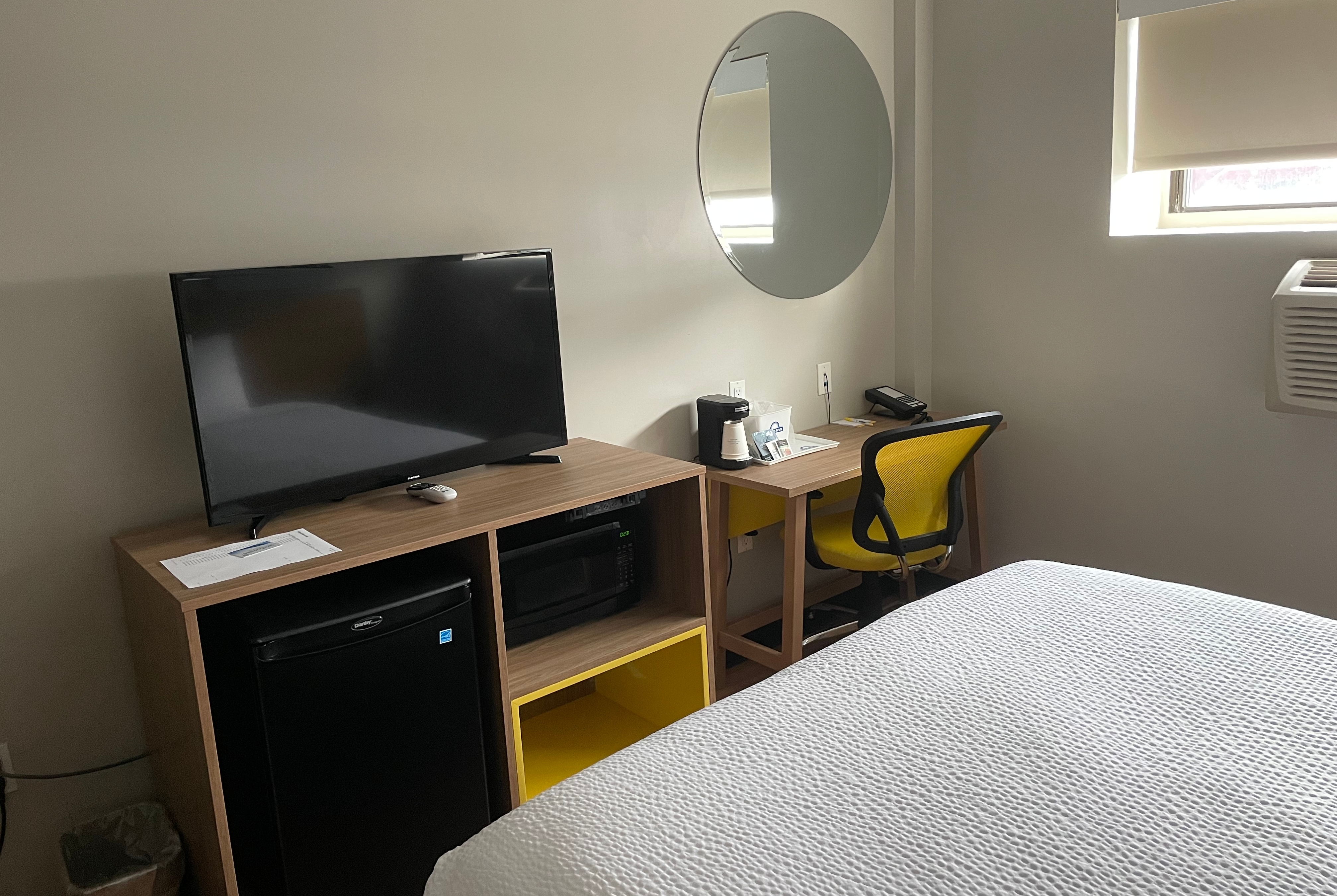 Guest room at the Days Inn & Suites by Wyndham Jamaica JFK Airport in Jamaica, New York