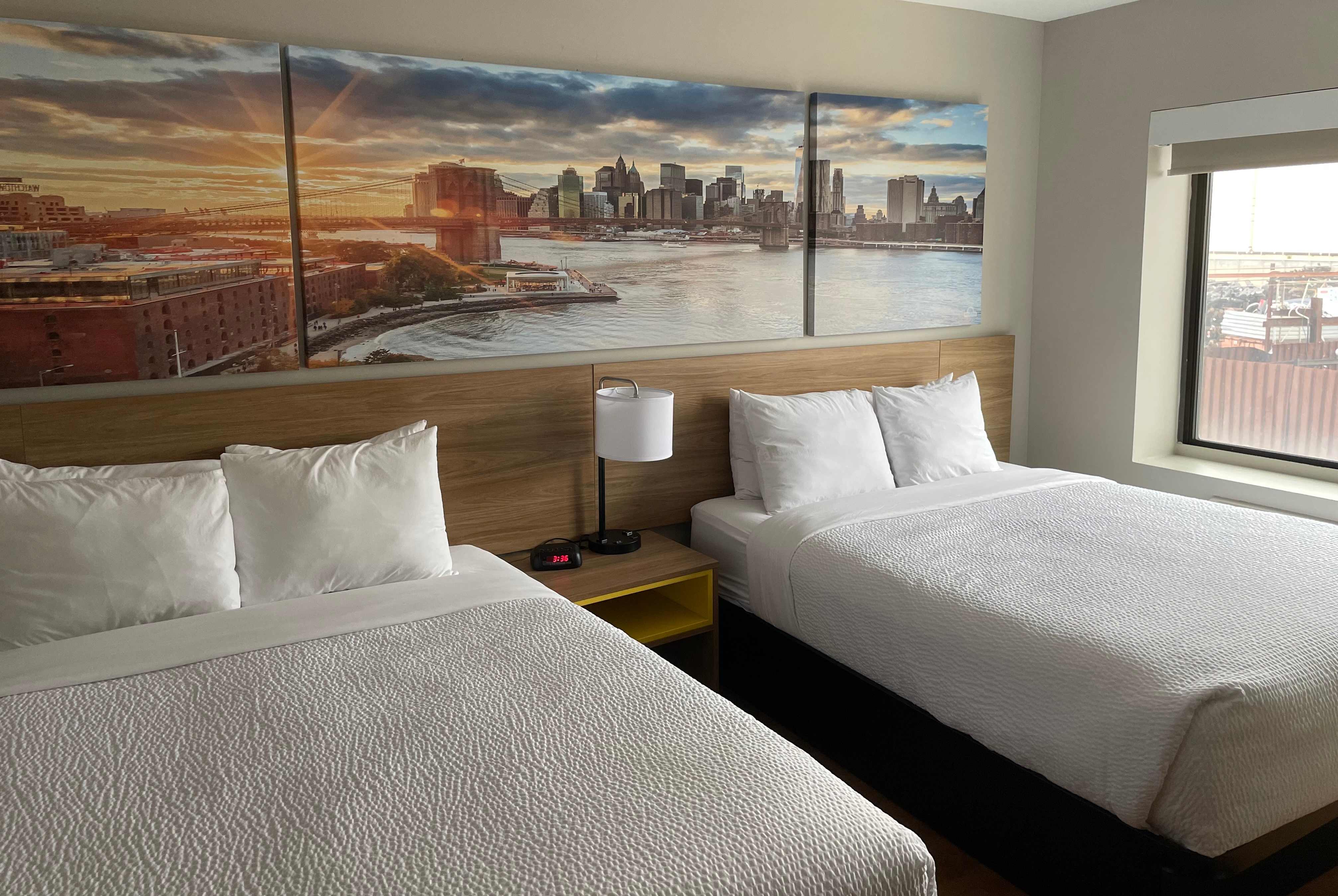 Guest room at the Days Inn & Suites by Wyndham Jamaica JFK Airport in Jamaica, New York