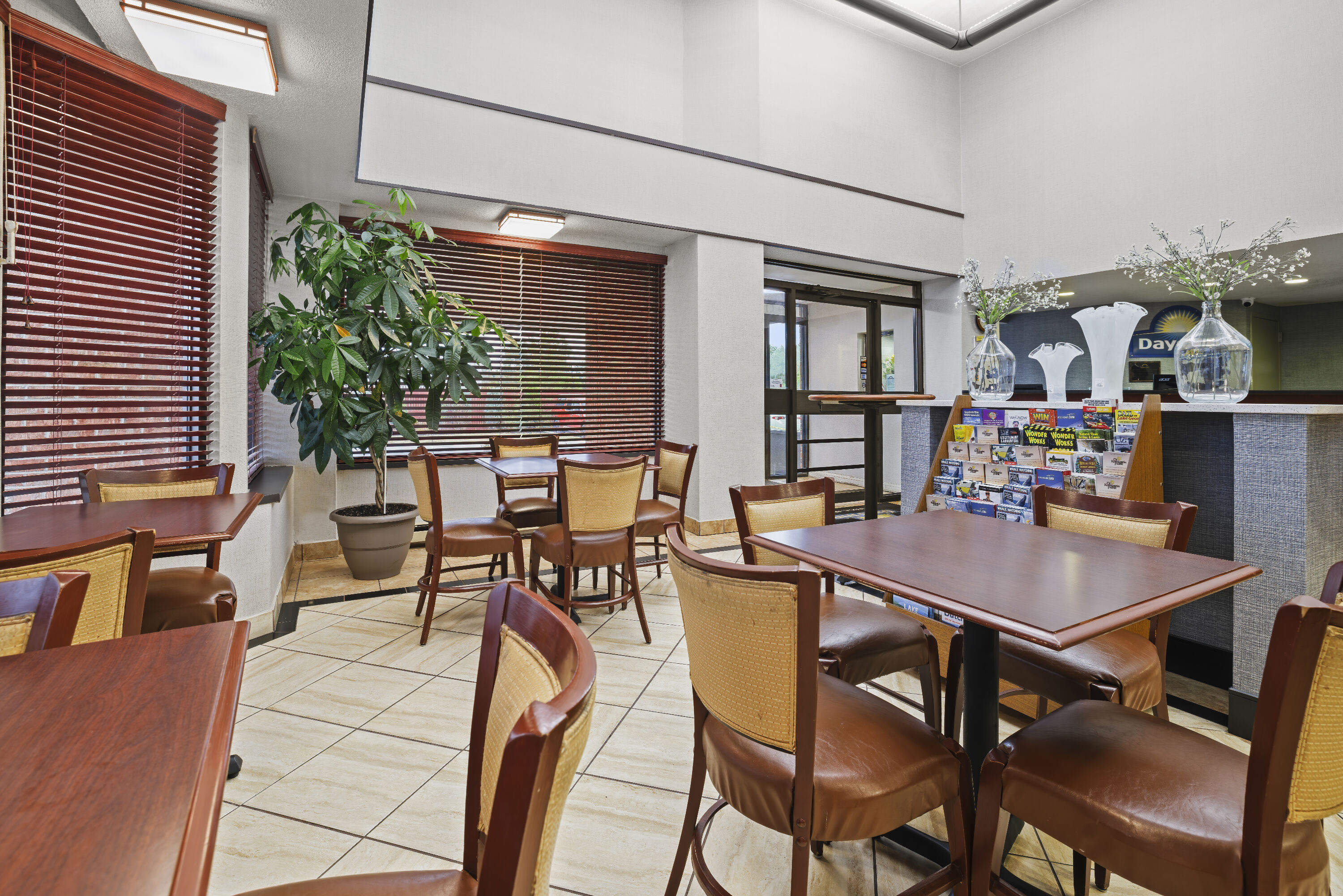 Days Inn by Wyndham Utica restaurant breakfast area with seating in Utica, New York