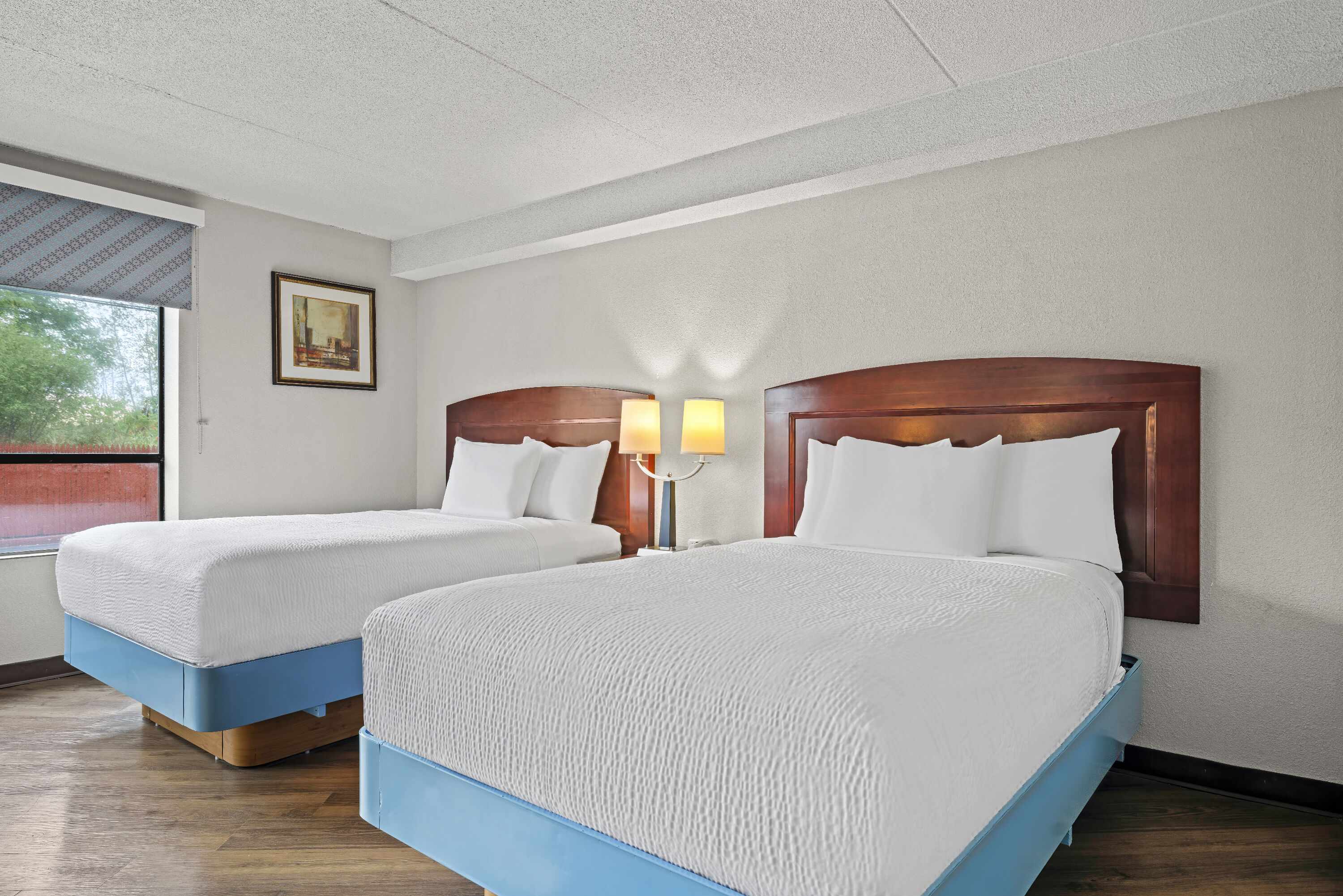 Double bed guest room at the Days Inn by Wyndham Utica in Utica, New York
