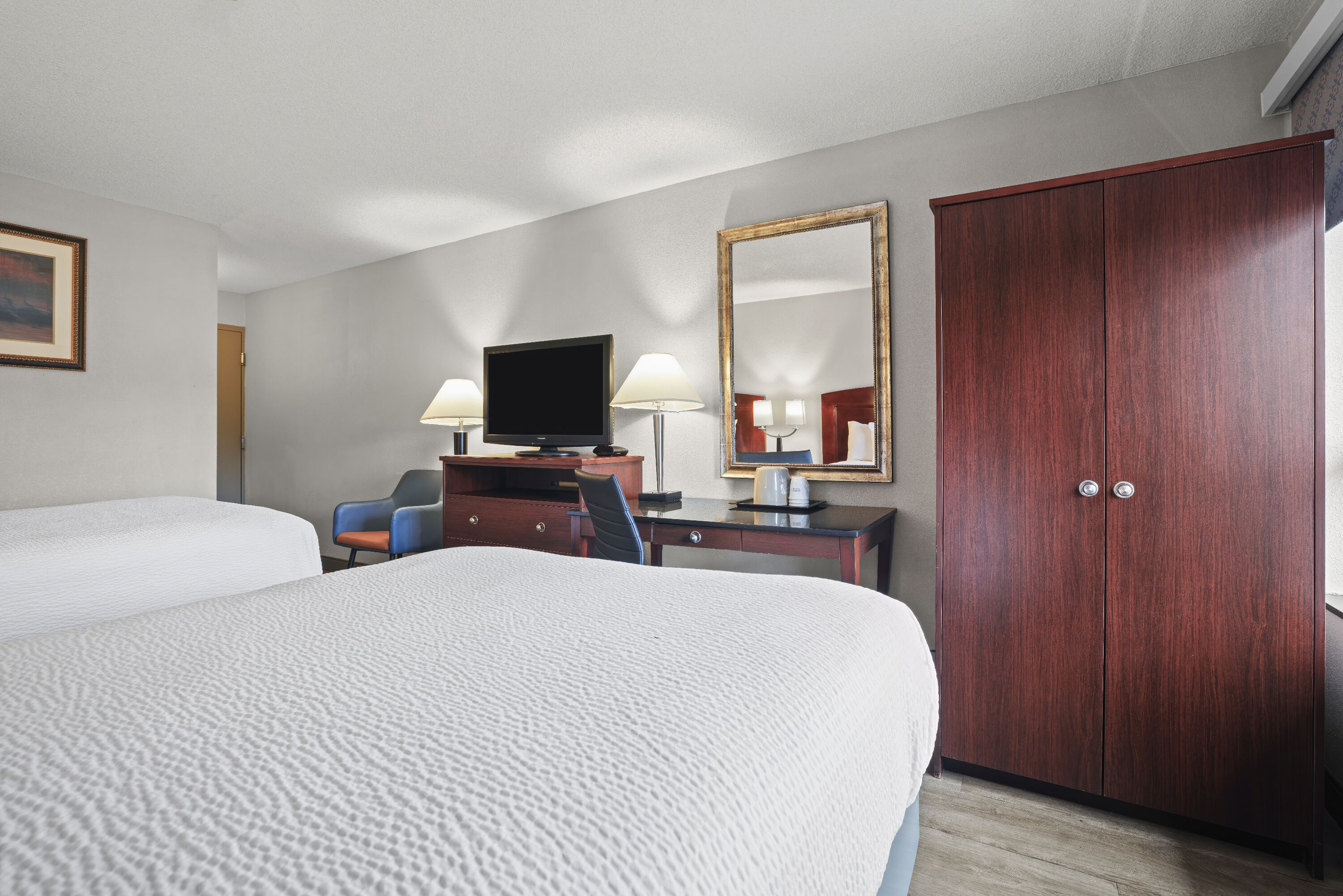 Double bed guest room at the Days Inn by Wyndham Utica in Utica, New York