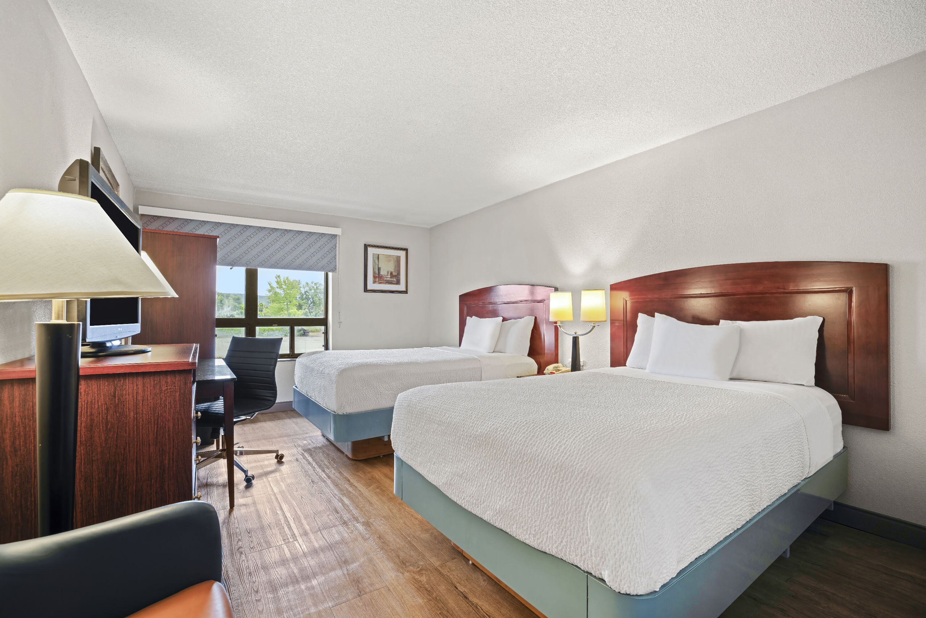 Double bed guest room at the Days Inn by Wyndham Utica in Utica, New York