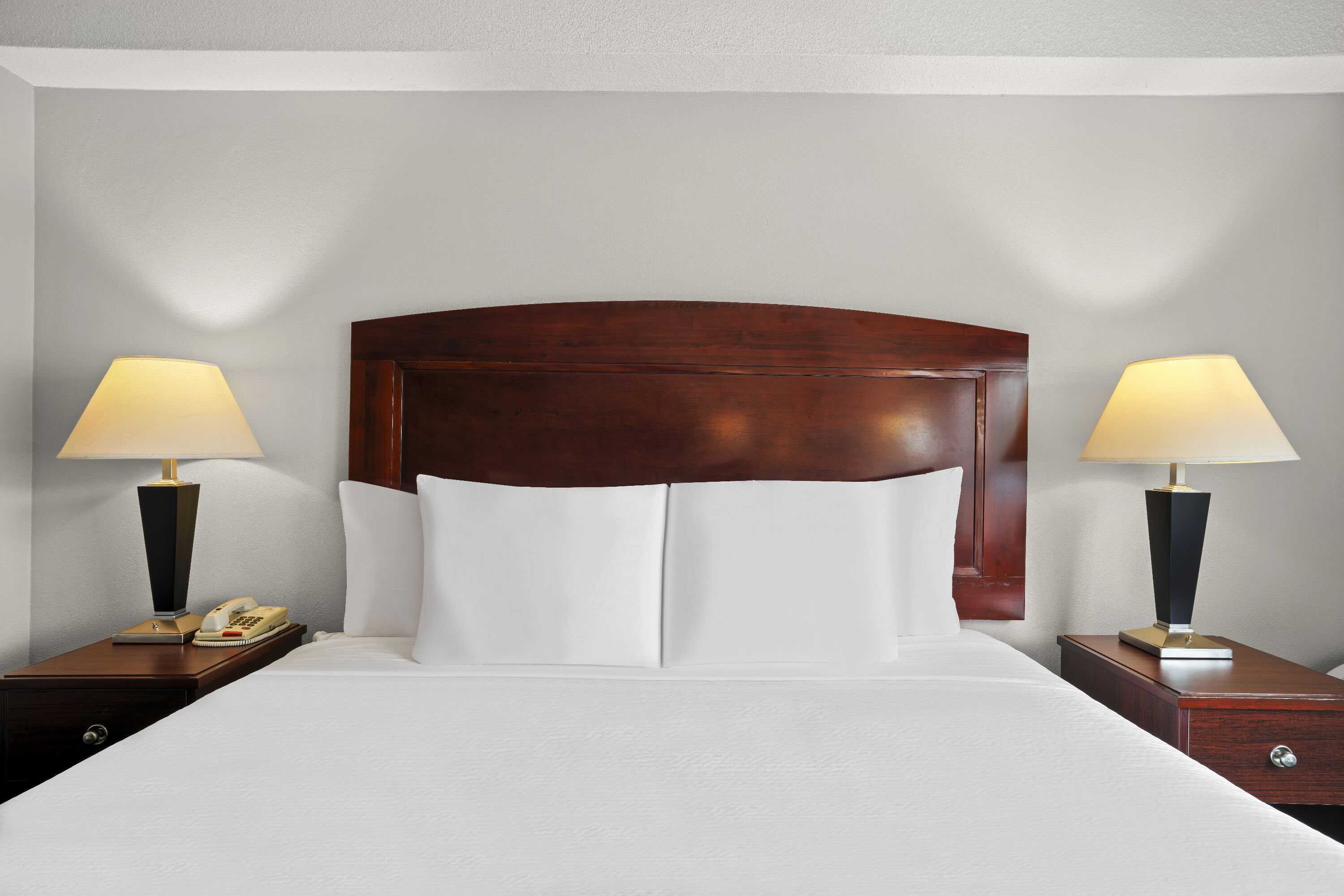 King bed guest room at the Days Inn by Wyndham Utica in Utica, New York