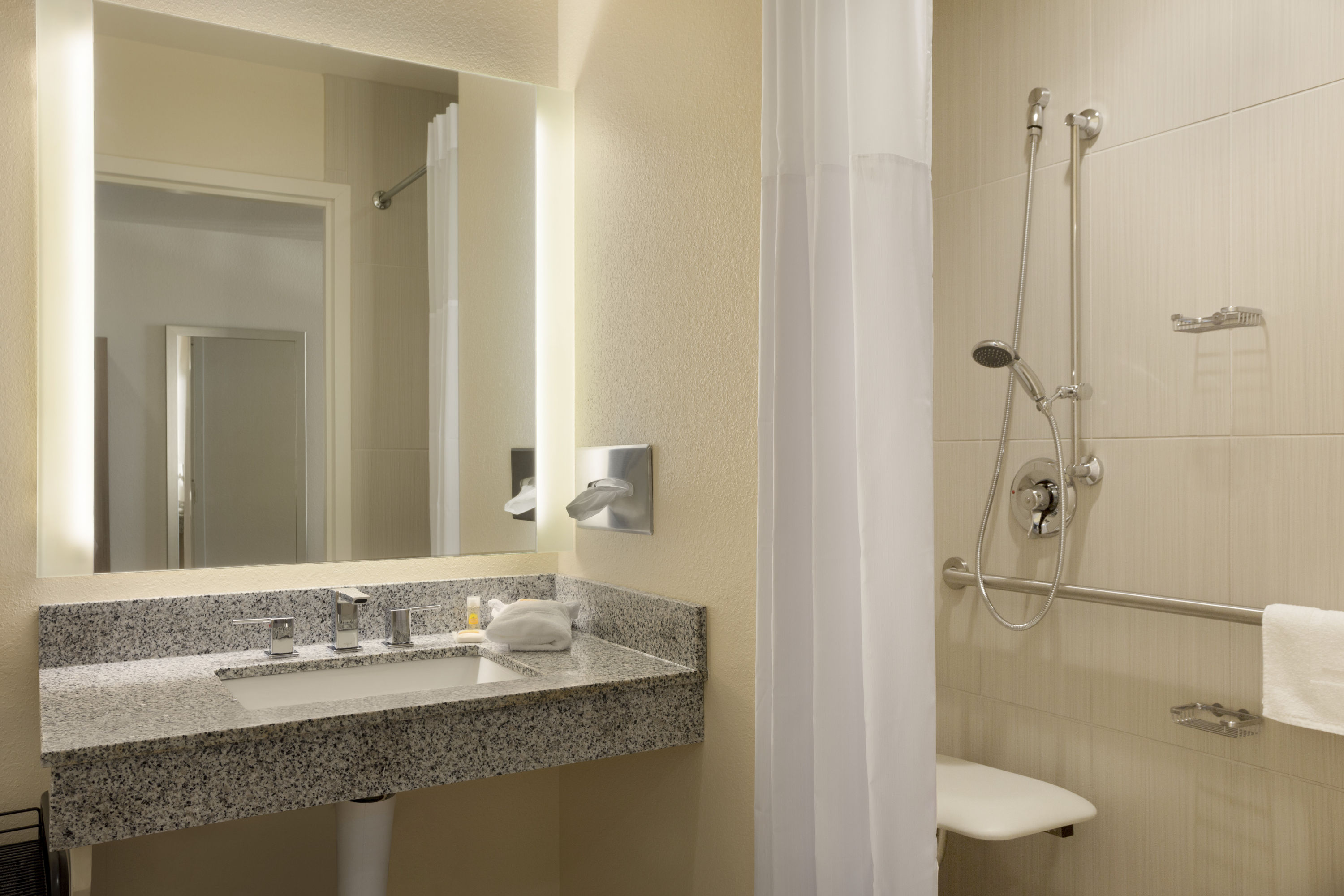 Guest room bath at the Days Inn & Suites by Wyndham Caldwell in Caldwell, Ohio