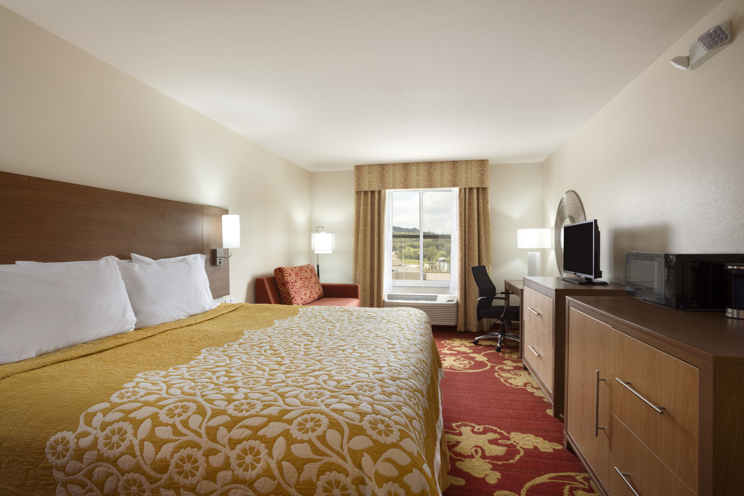Guest room at the Days Inn & Suites by Wyndham Caldwell in Caldwell, Ohio