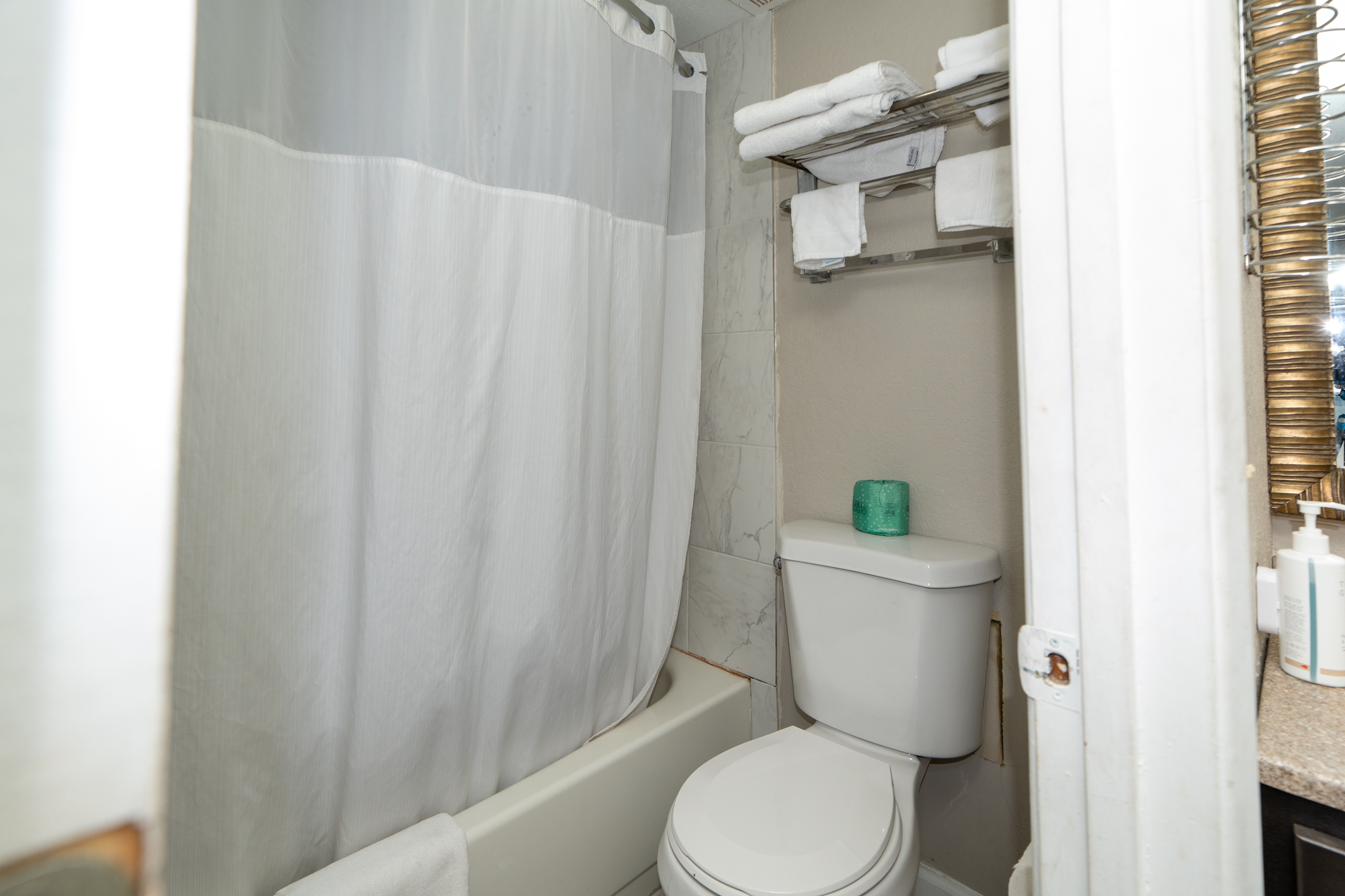 Guest room bath at the Days Inn & Suites by Wyndham Dayton North in Dayton, Ohio