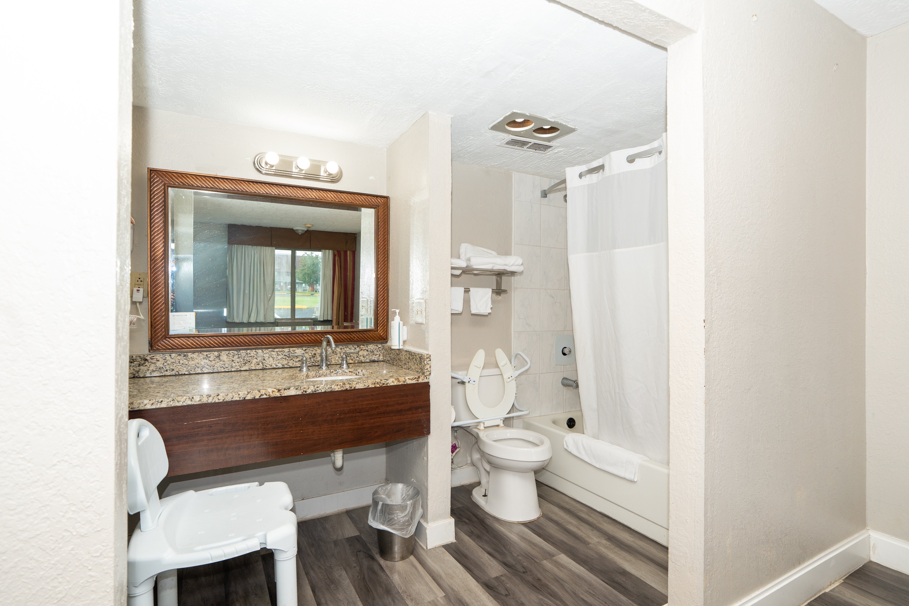 Guest room bath at the Days Inn & Suites by Wyndham Dayton North in Dayton, Ohio