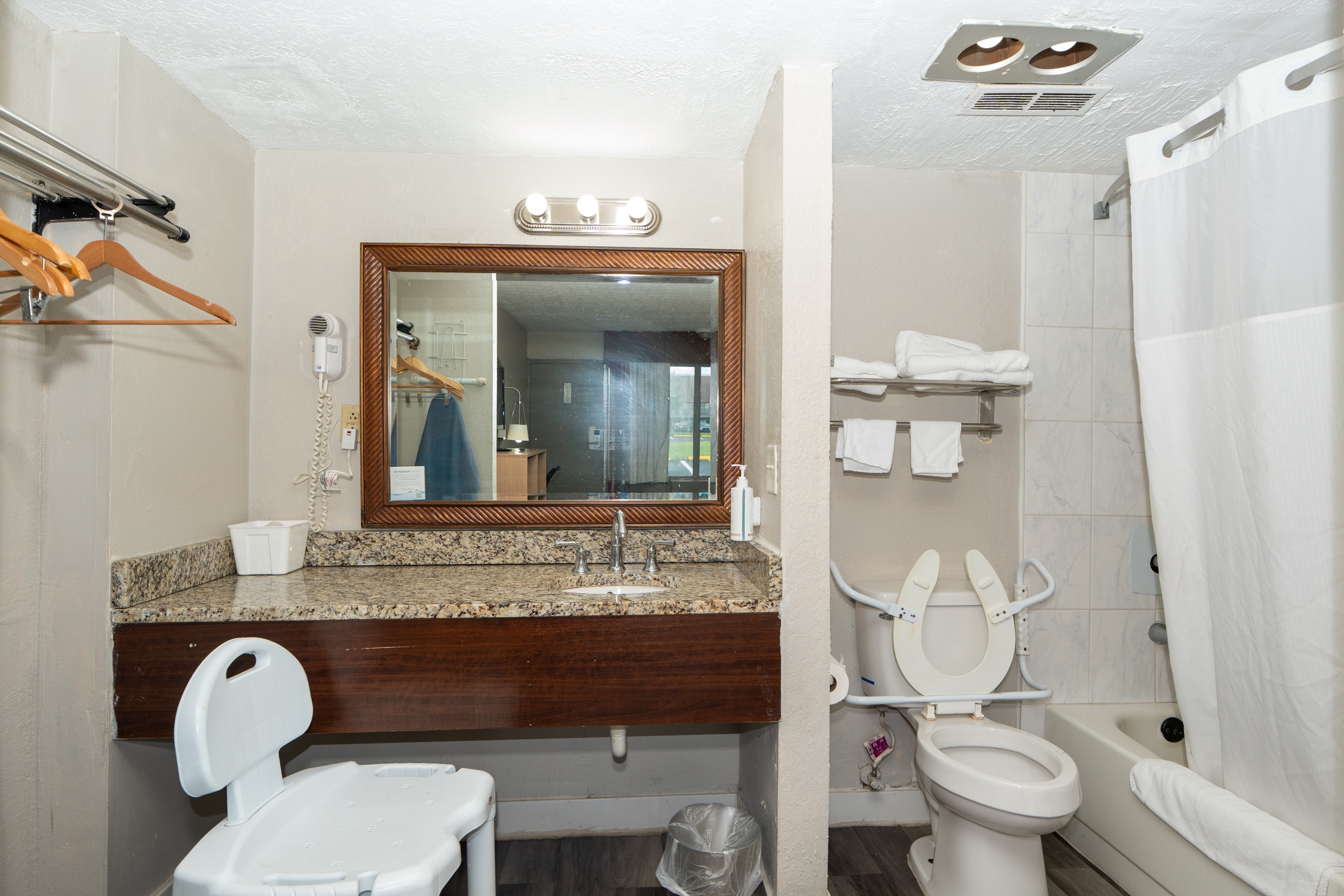 Guest room bath at the Days Inn & Suites by Wyndham Dayton North in Dayton, Ohio