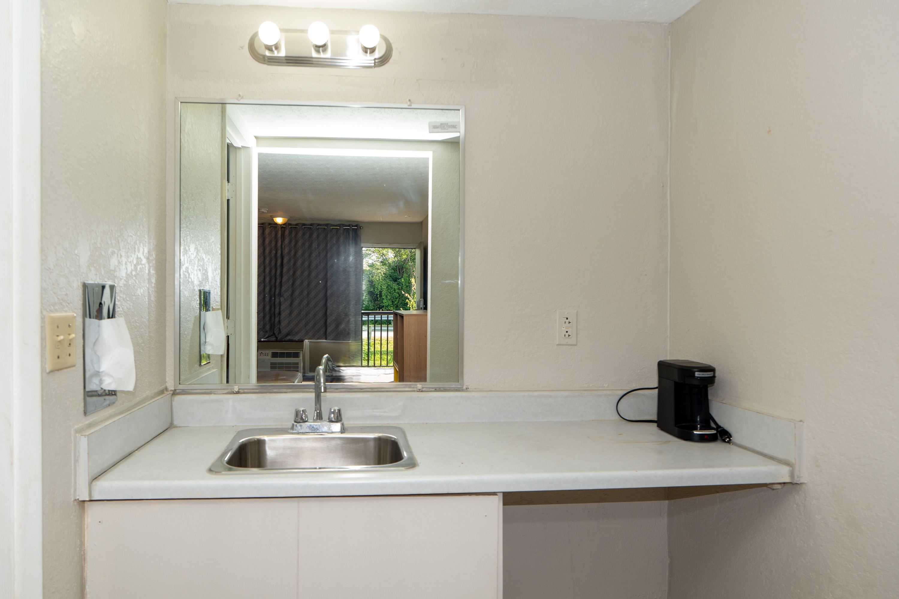 Guest room bath at the Days Inn & Suites by Wyndham Dayton North in Dayton, Ohio