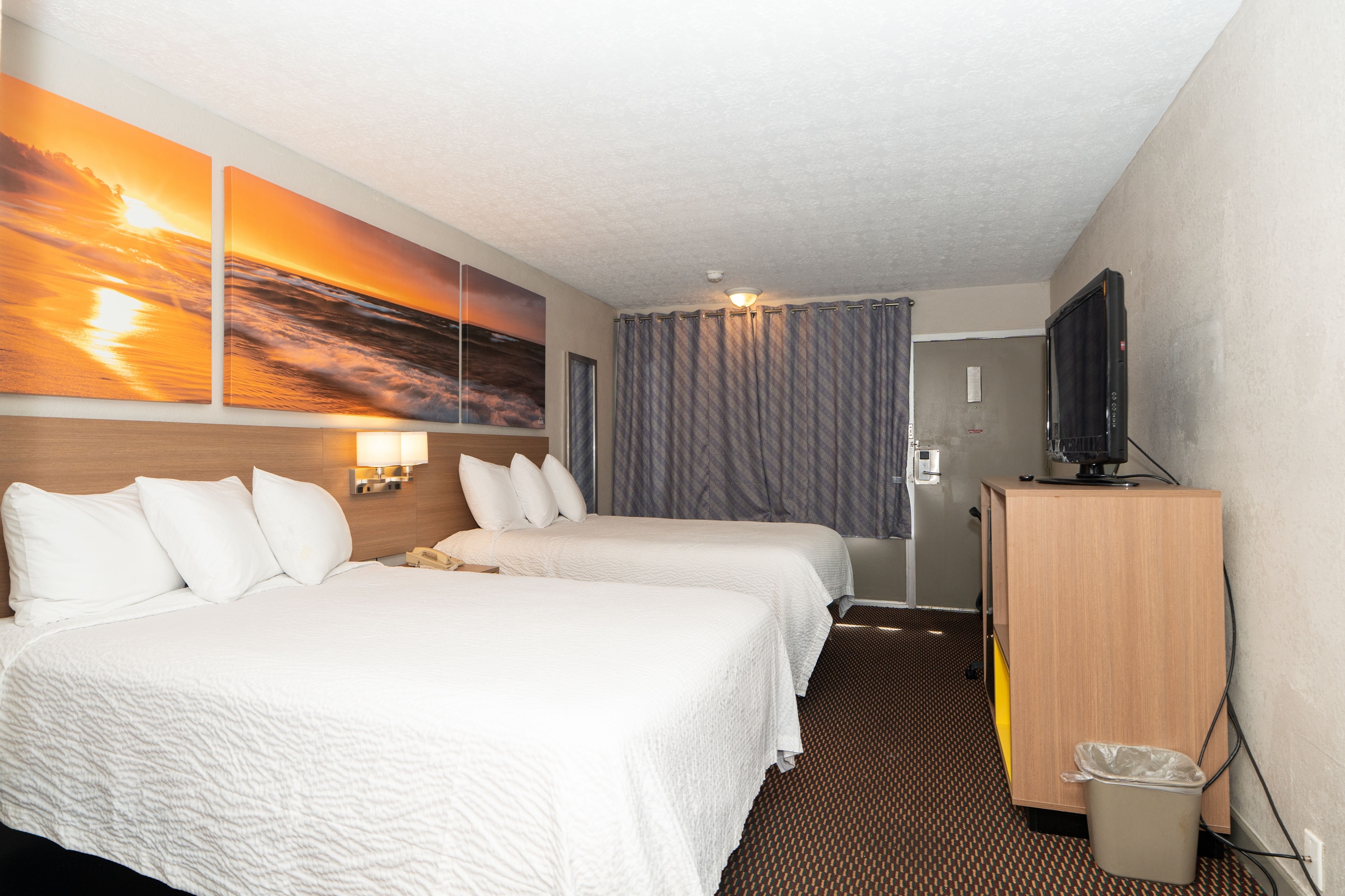 Guest room at the Days Inn & Suites by Wyndham Dayton North in Dayton, Ohio
