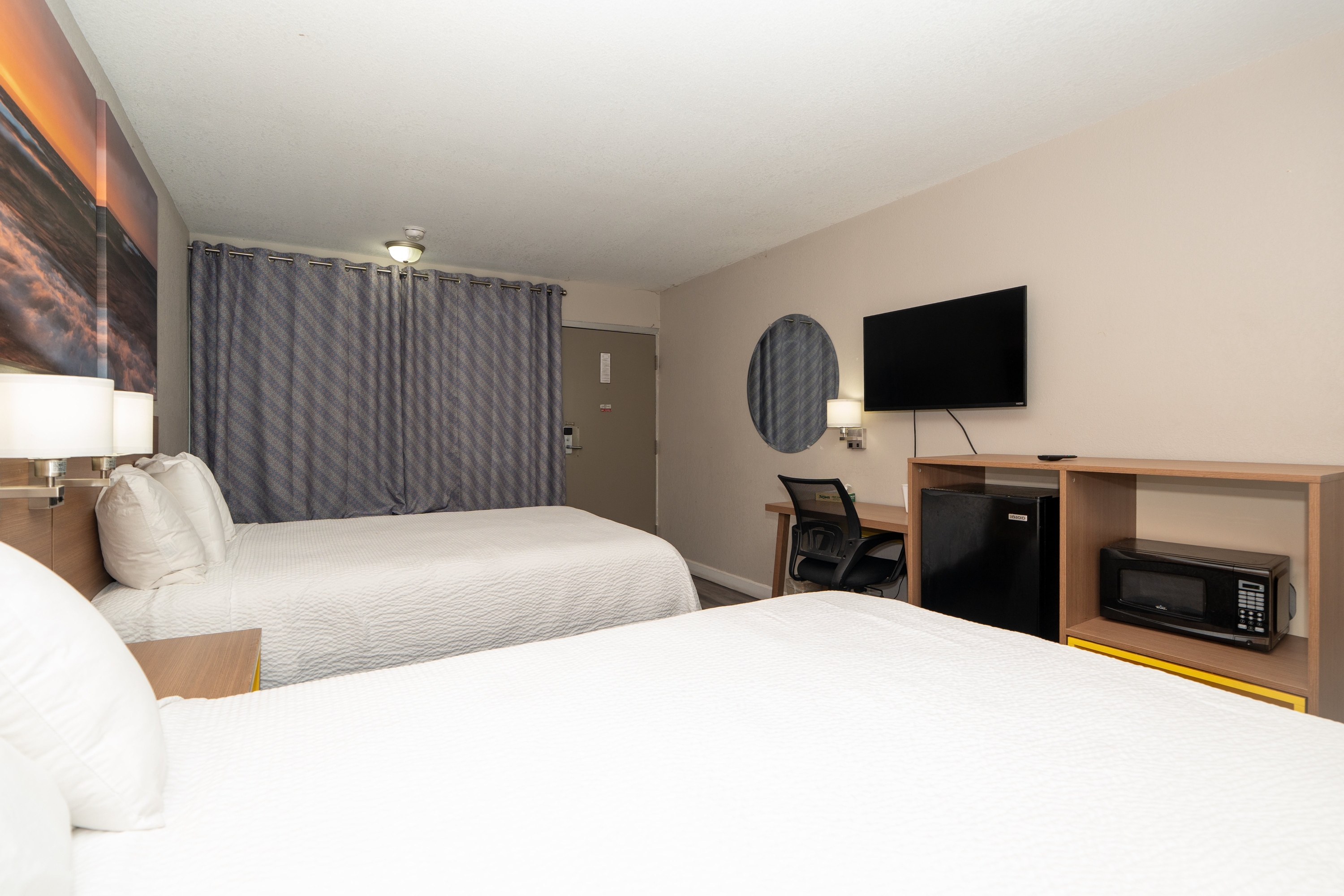 Guest room at the Days Inn & Suites by Wyndham Dayton North in Dayton, Ohio