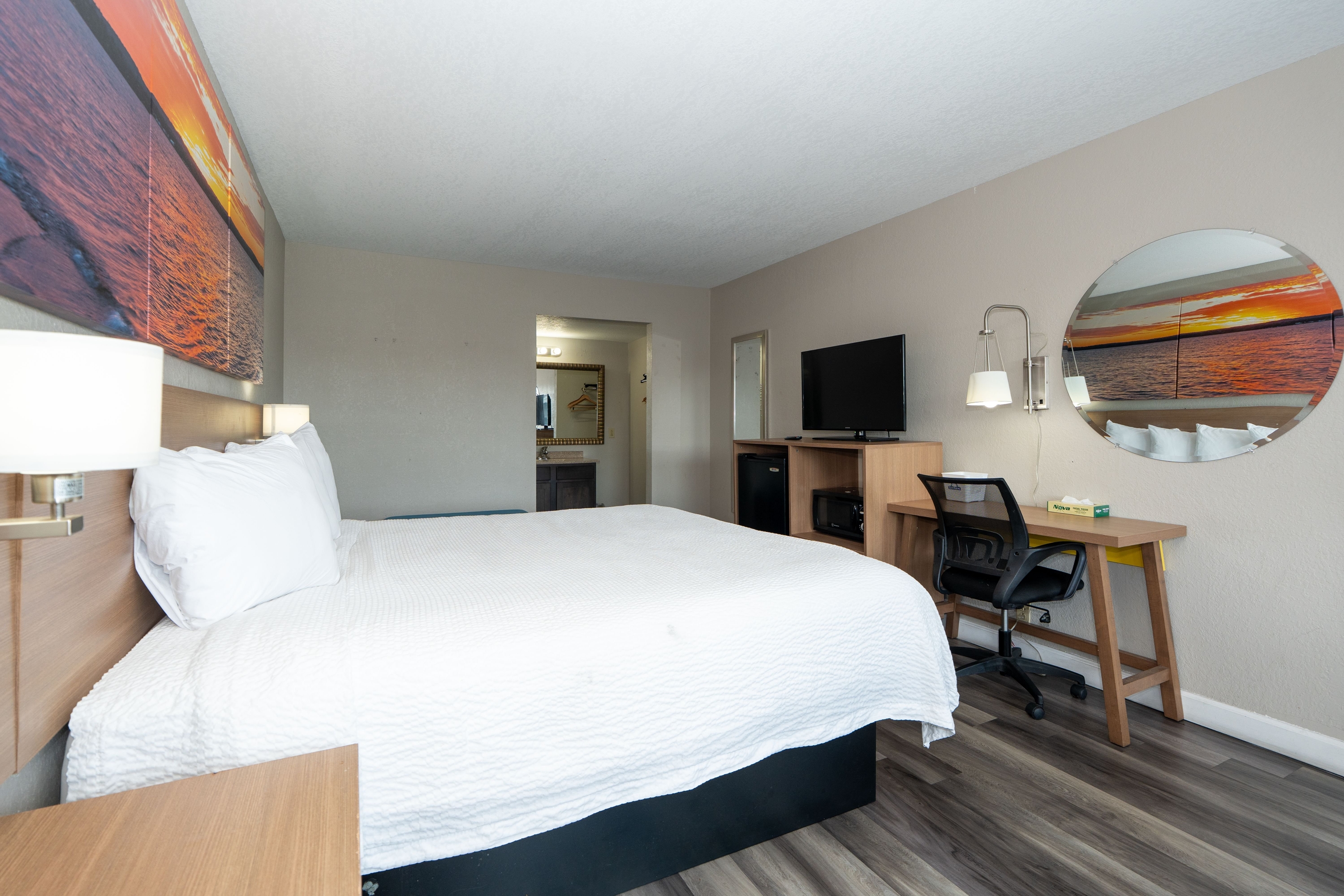 Guest room at the Days Inn & Suites by Wyndham Dayton North in Dayton, Ohio