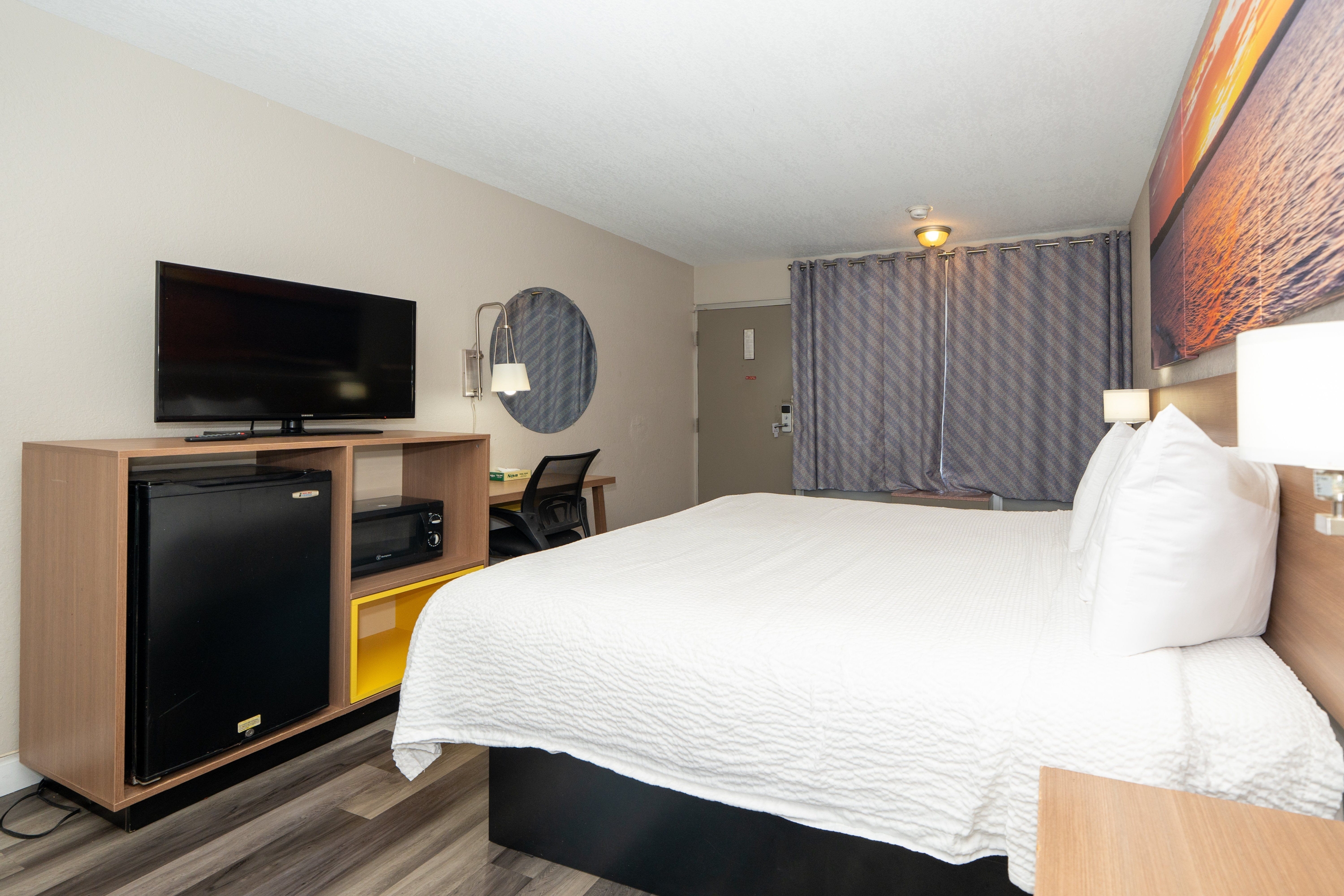 Guest room at the Days Inn & Suites by Wyndham Dayton North in Dayton, Ohio