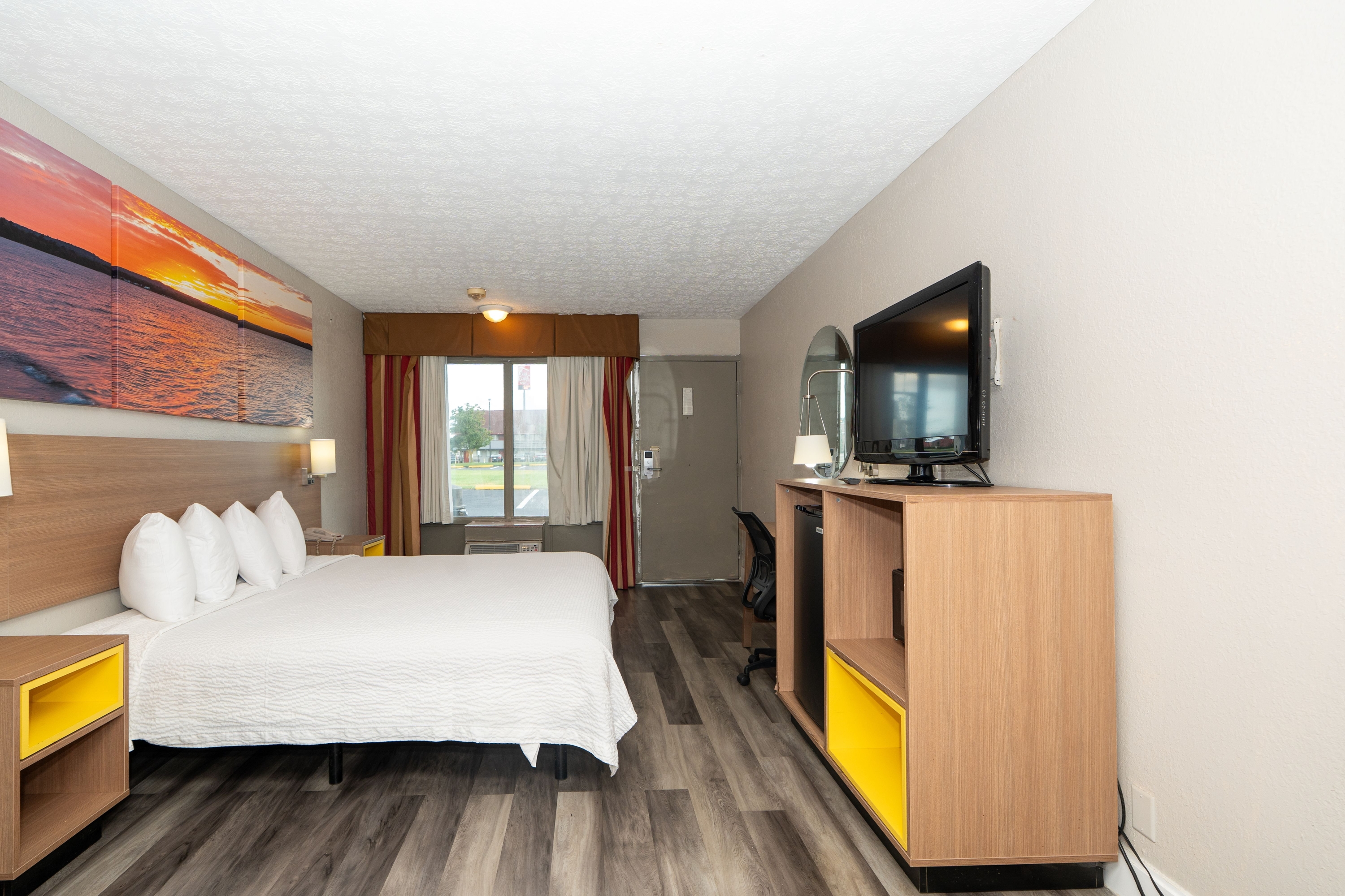 Guest room at the Days Inn & Suites by Wyndham Dayton North in Dayton, Ohio