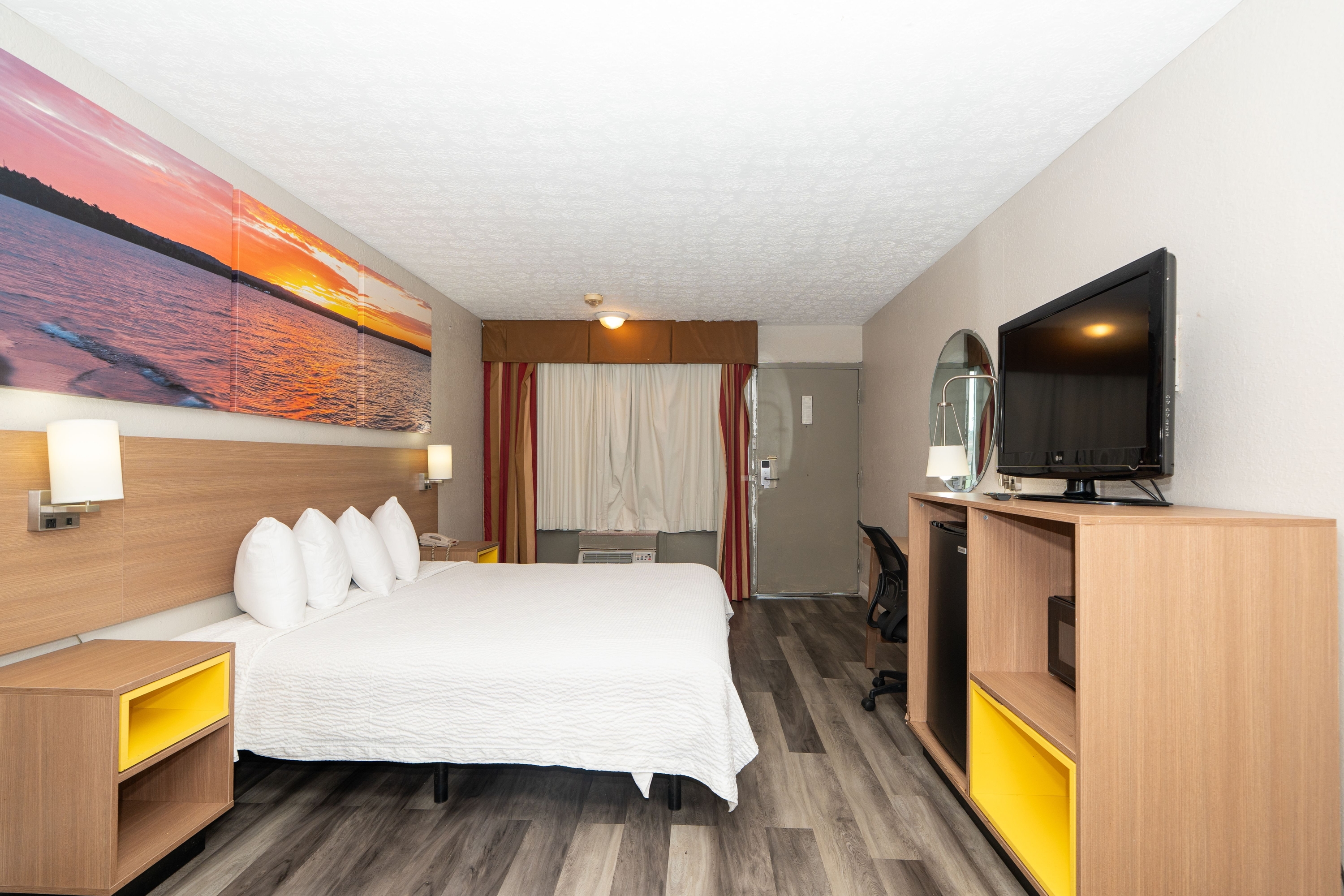 Guest room at the Days Inn & Suites by Wyndham Dayton North in Dayton, Ohio