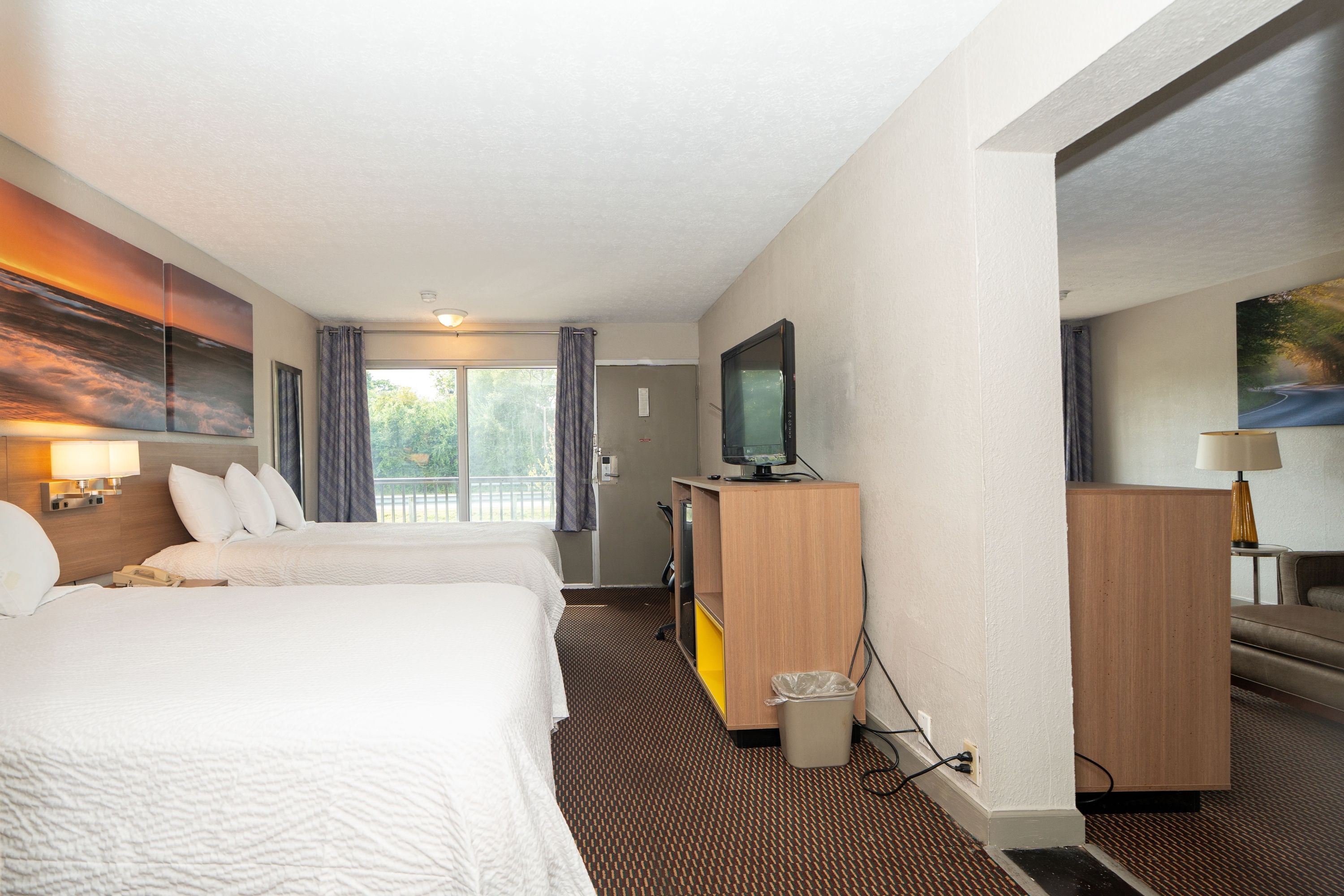Guest room at the Days Inn & Suites by Wyndham Dayton North in Dayton, Ohio