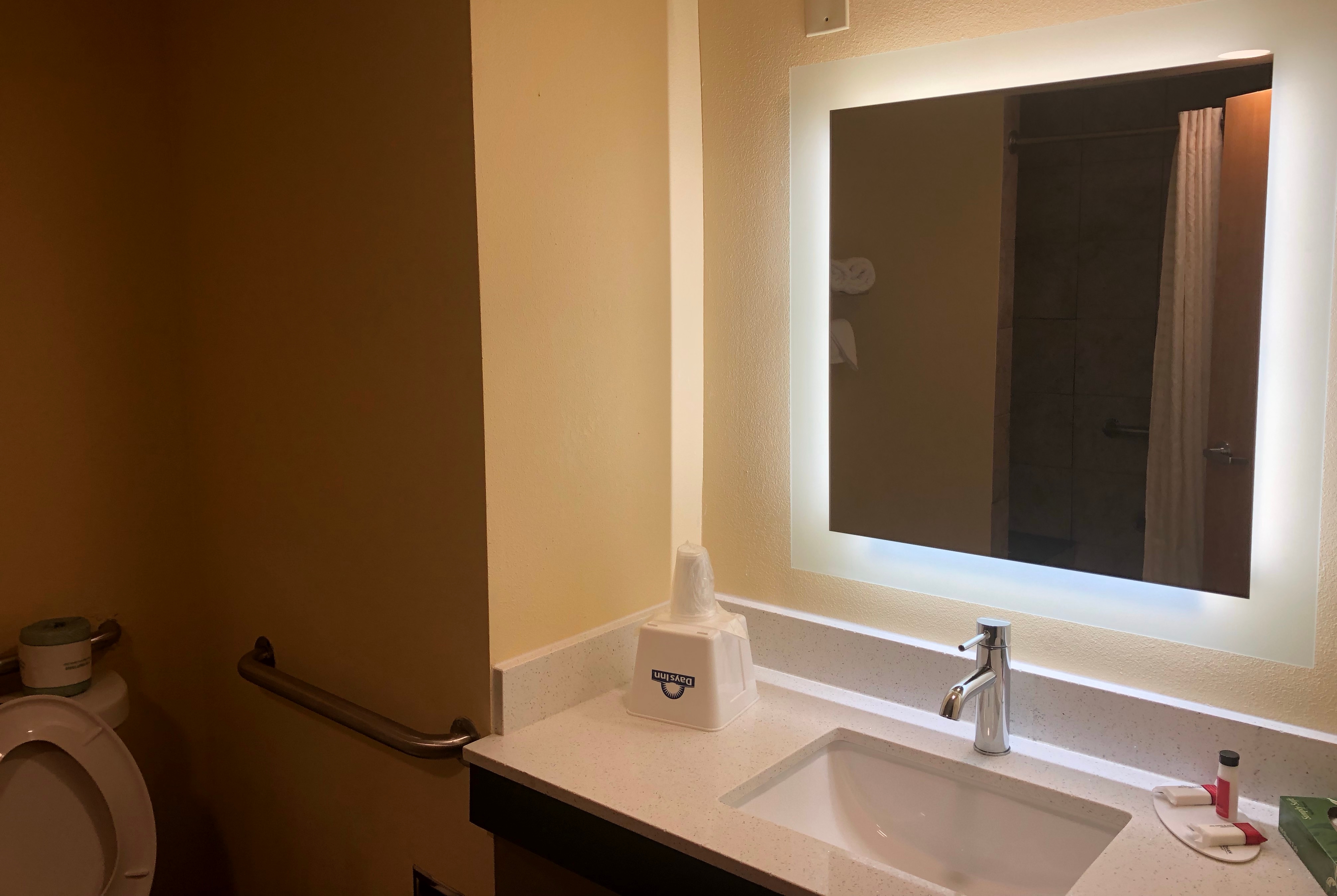 Guest room bath at the Days Inn by Wyndham Grove City Columbus South in Grove City, Ohio