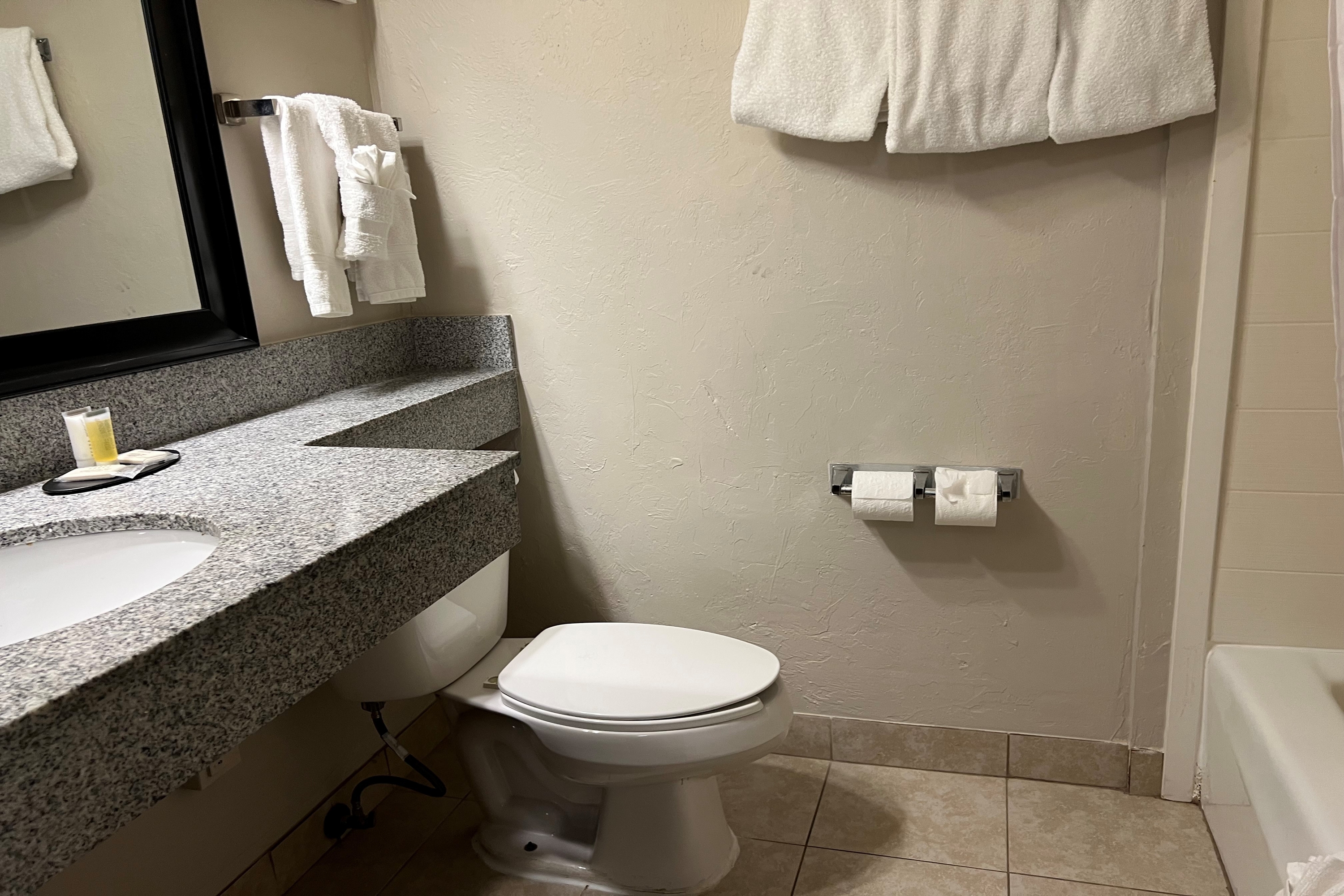Guest room bath at the Days Inn by Wyndham Norman in Norman, Oklahoma