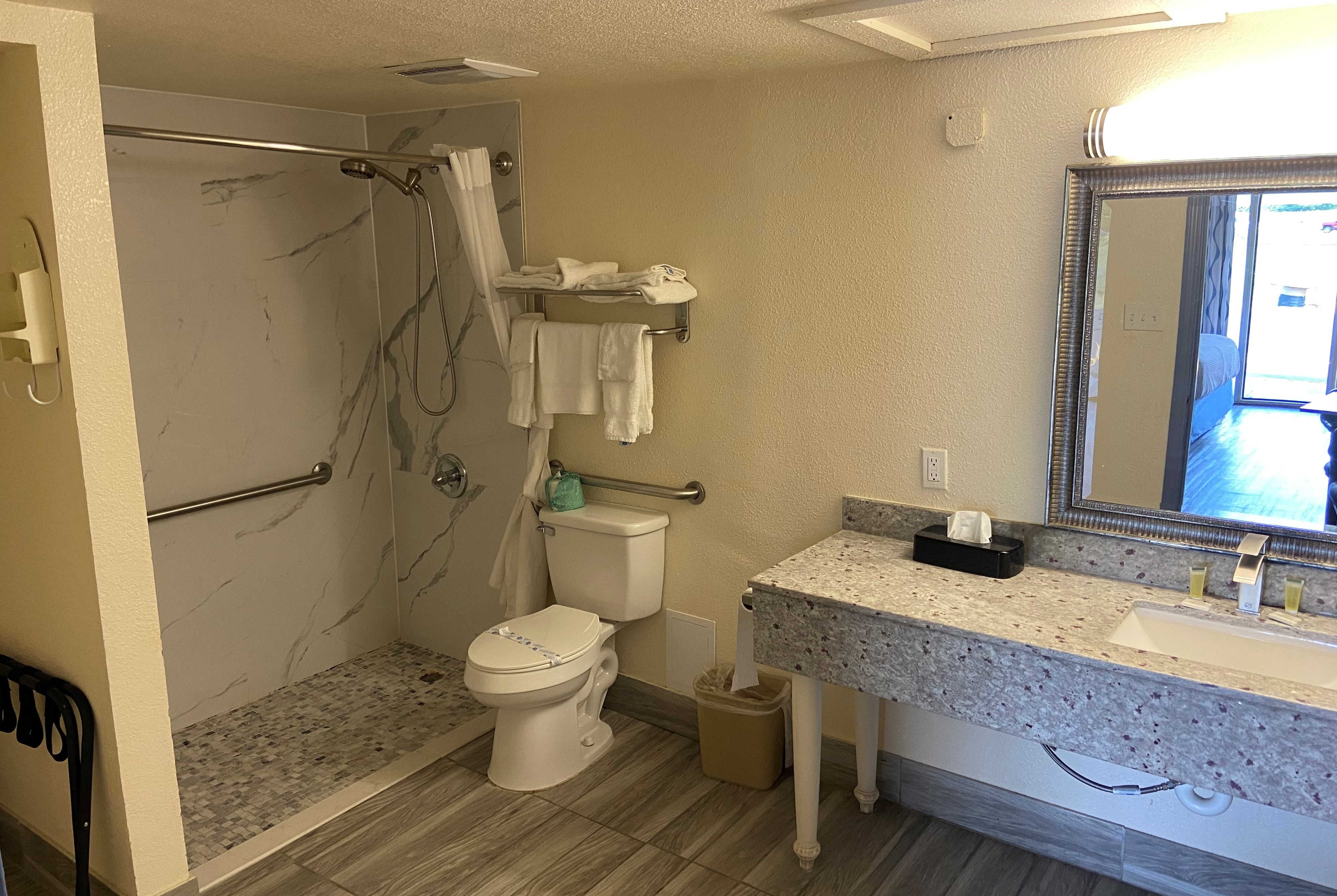 Guest room bath at the Days Inn by Wyndham Okmulgee in Okmulgee, Oklahoma