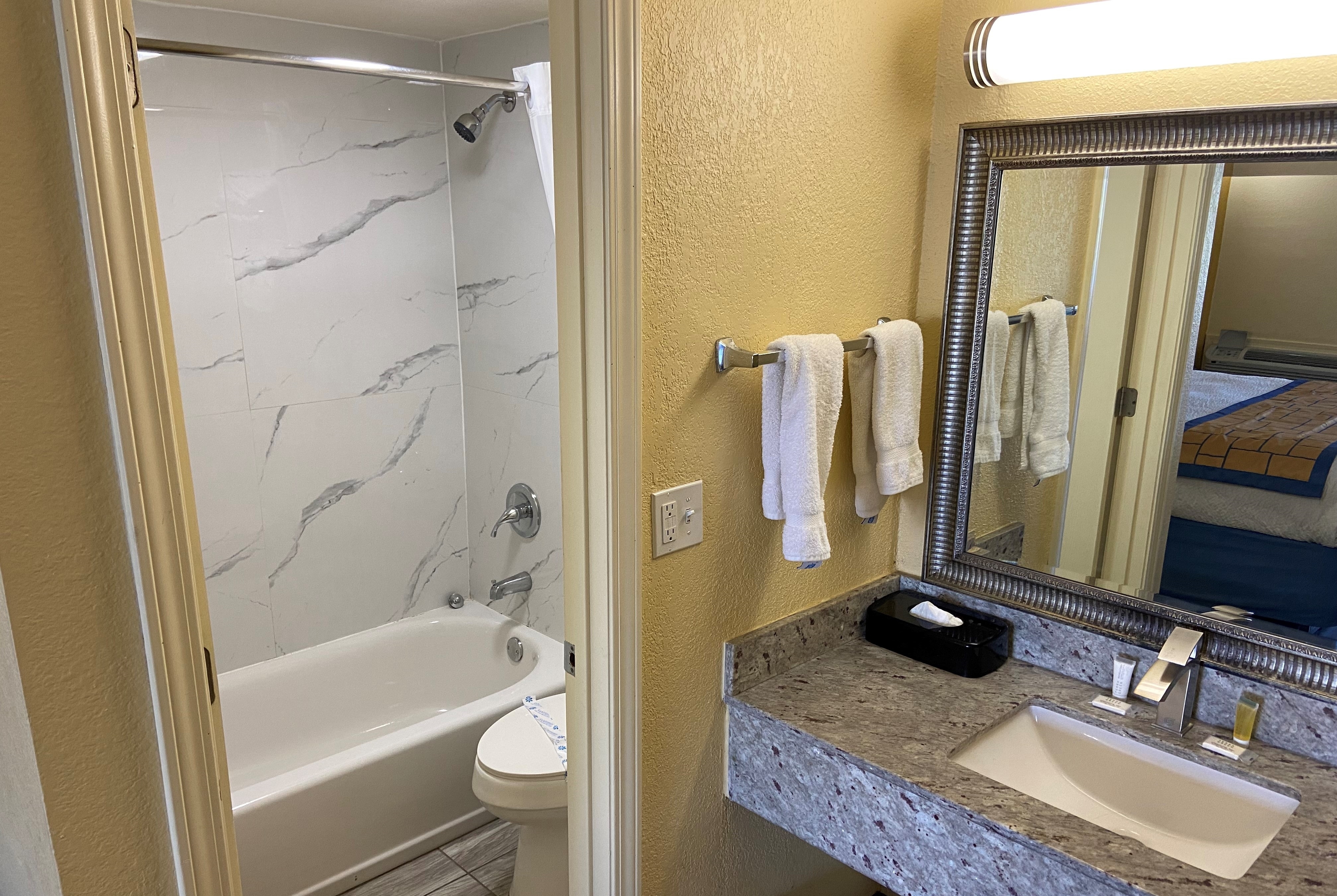 Guest room bath at the Days Inn by Wyndham Okmulgee in Okmulgee, Oklahoma