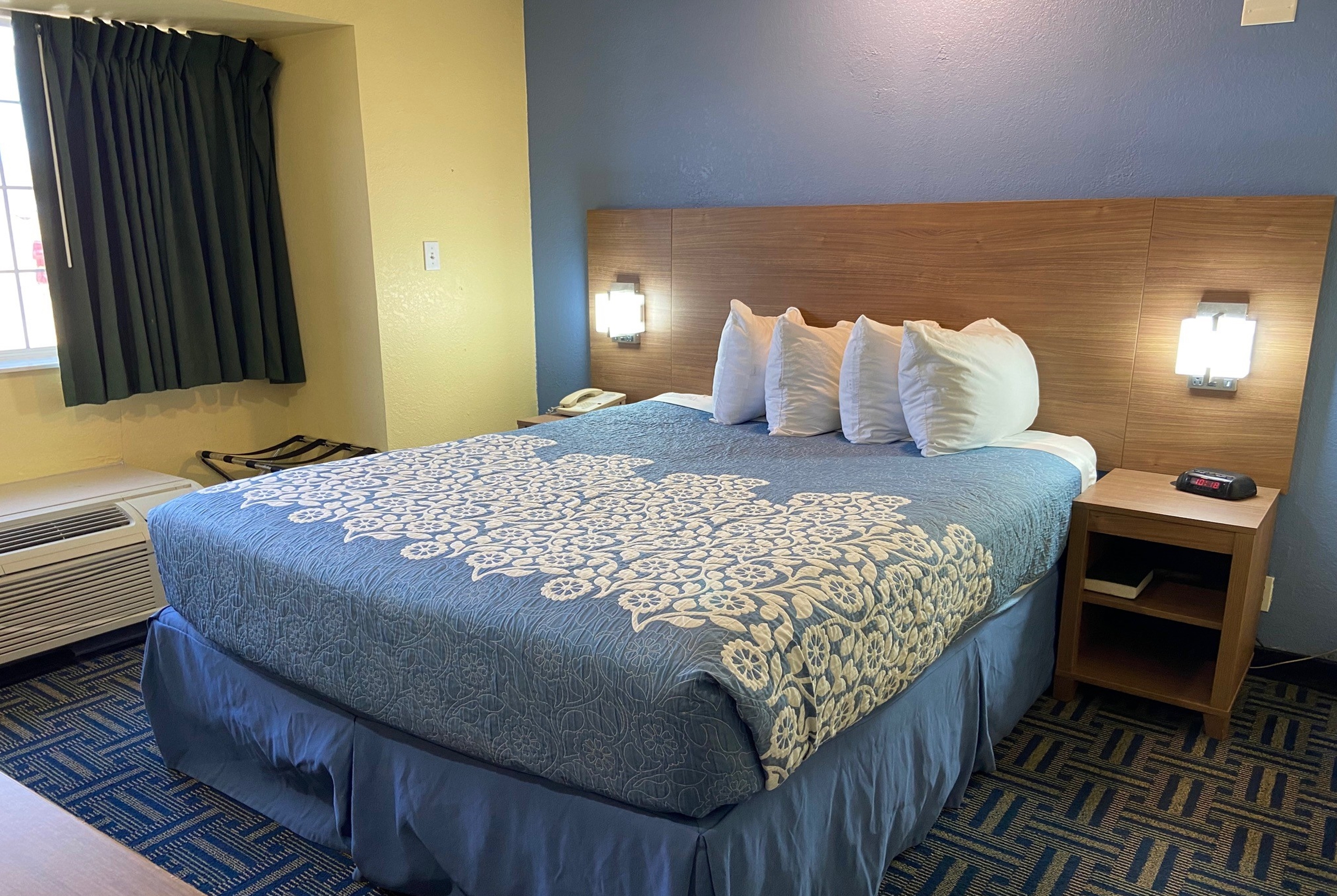Guest room at the Days Inn & Suites by Wyndham Pryor in Pryor, Oklahoma