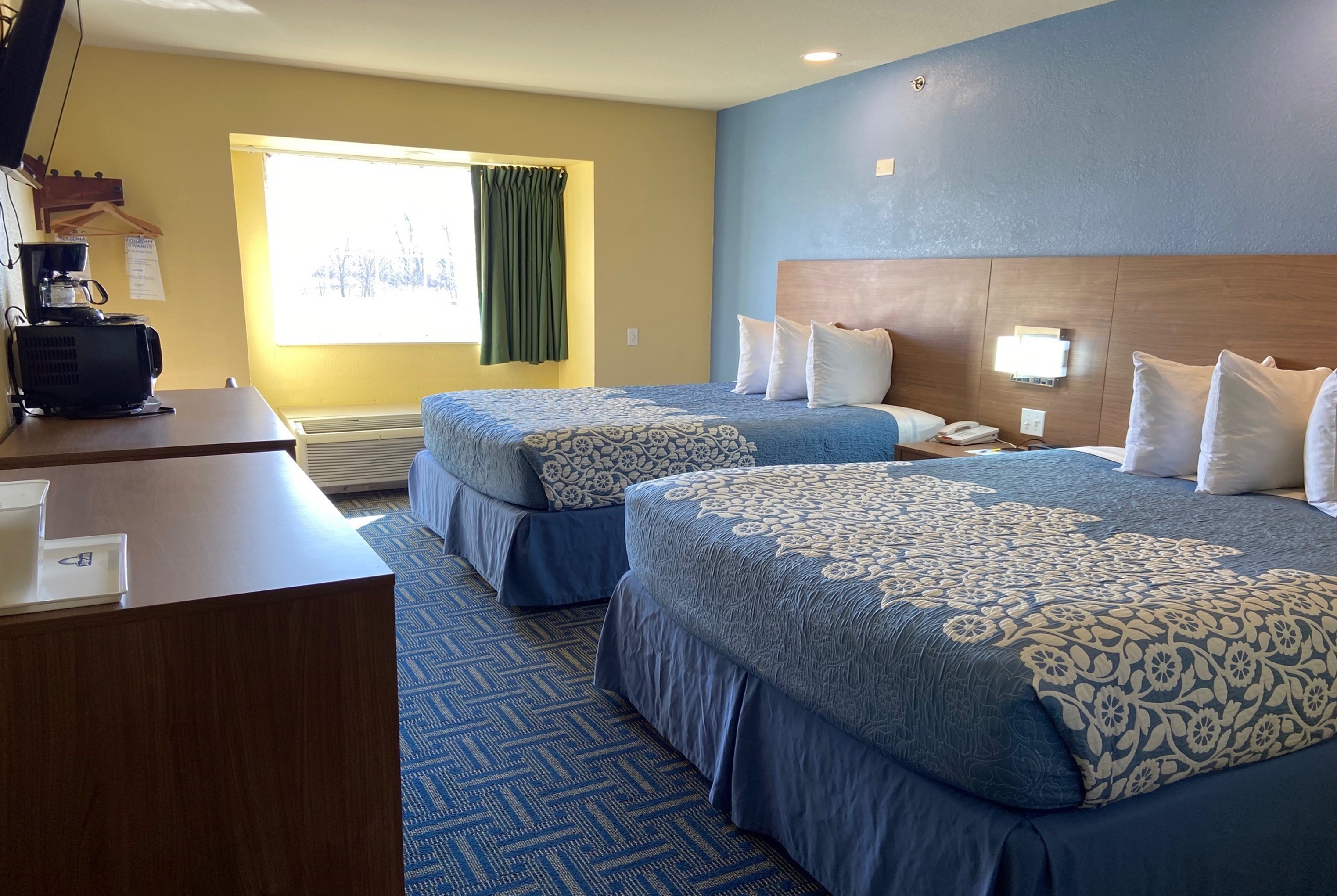 Guest room at the Days Inn & Suites by Wyndham Pryor in Pryor, Oklahoma
