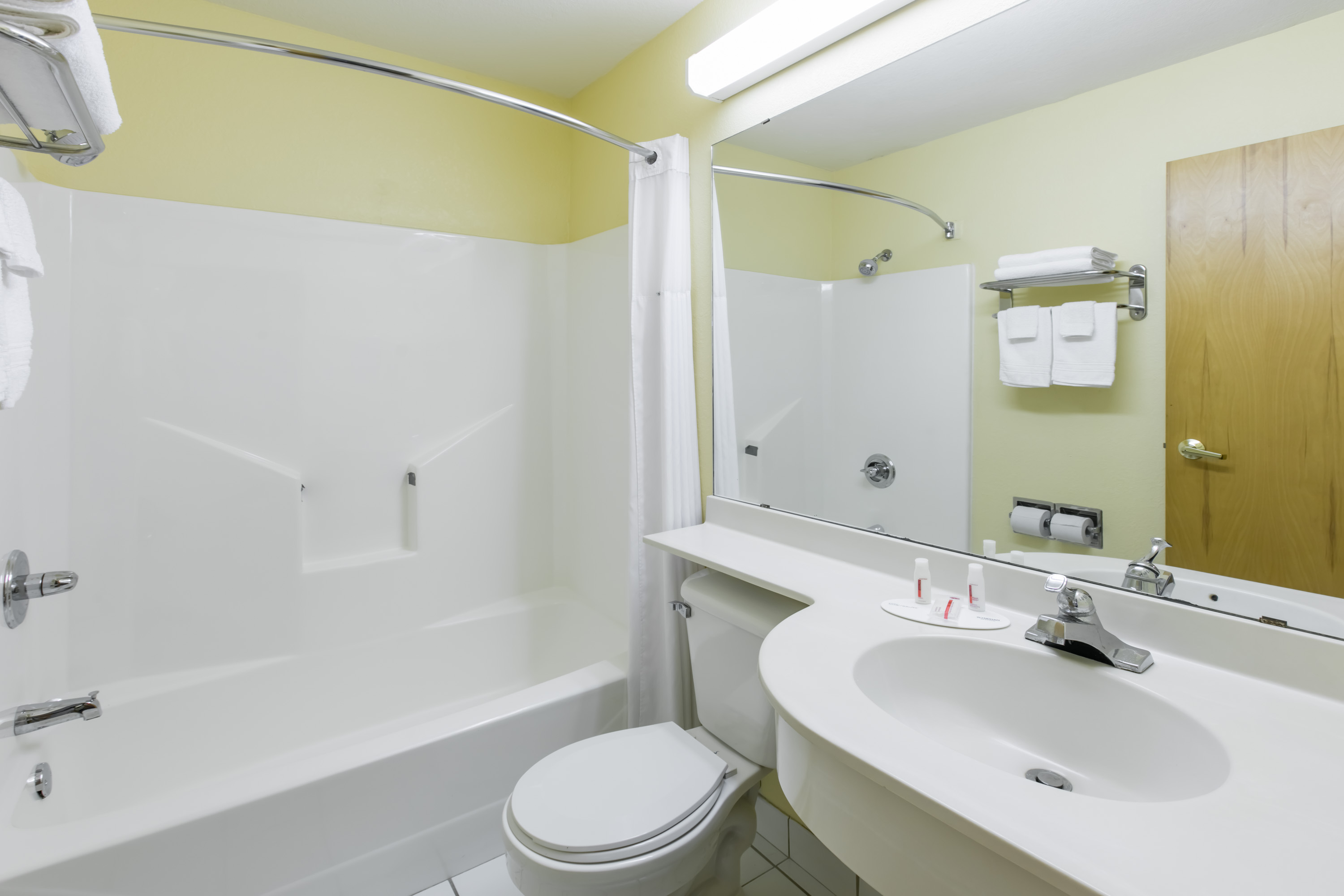 Guest room at the Days Inn & Suites by Wyndham Pryor in Pryor, Oklahoma