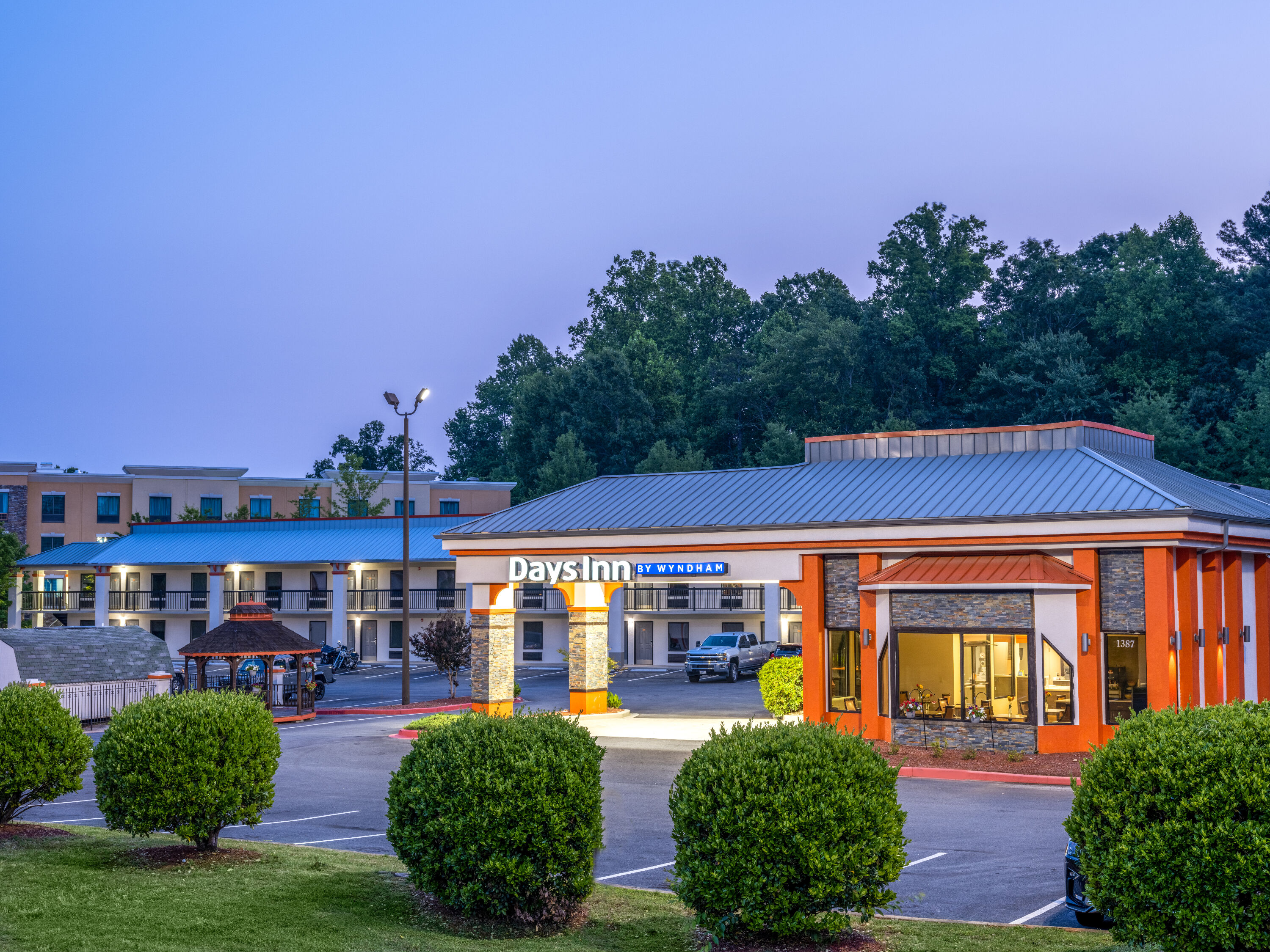 Exterior Dusk Image of Days Inn by Wyndham Clemson hotel in Clemson, South Carolina