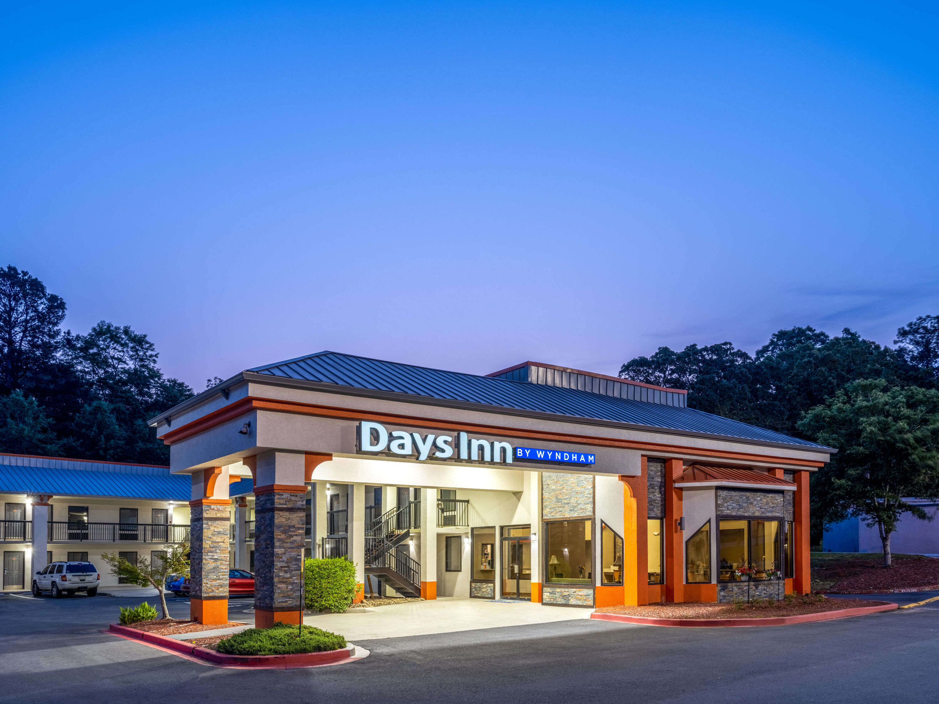Exterior Dusk Image of Days Inn by Wyndham Clemson hotel in Clemson, South Carolina