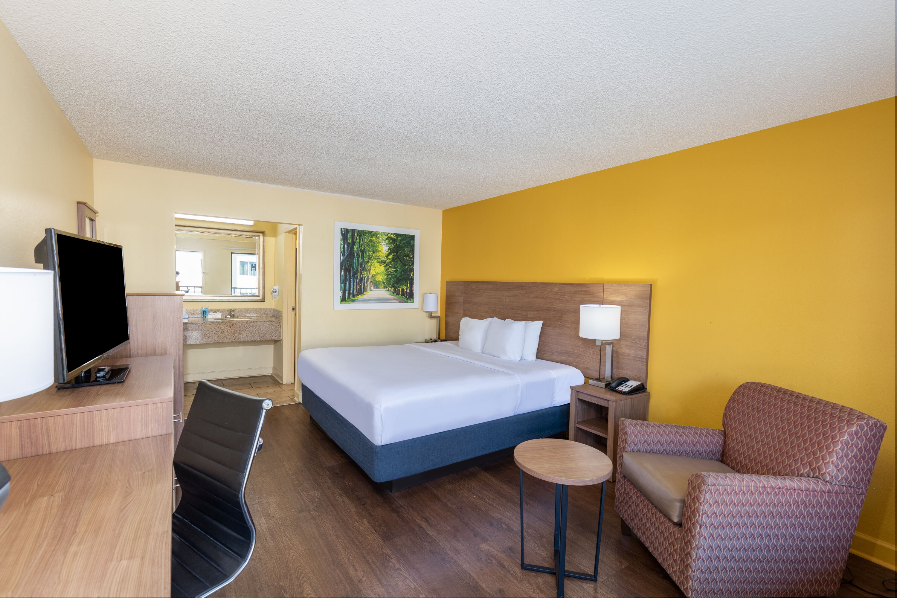 King bed guest room at the Days Inn by Wyndham Florence/I-95 North in Florence, South Carolina