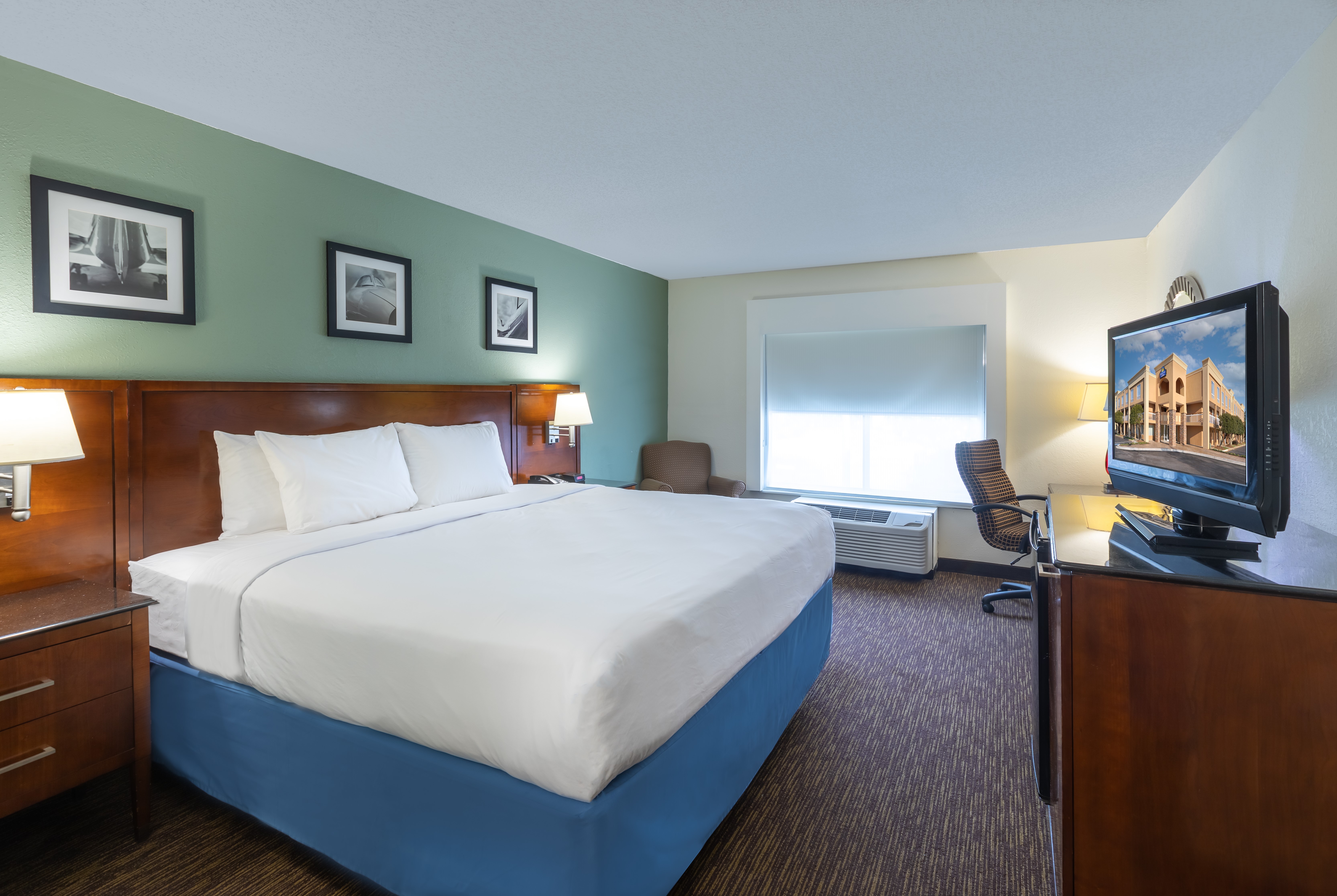 Guest room at the Days Inn by Wyndham Greenville in Greenville, South Carolina