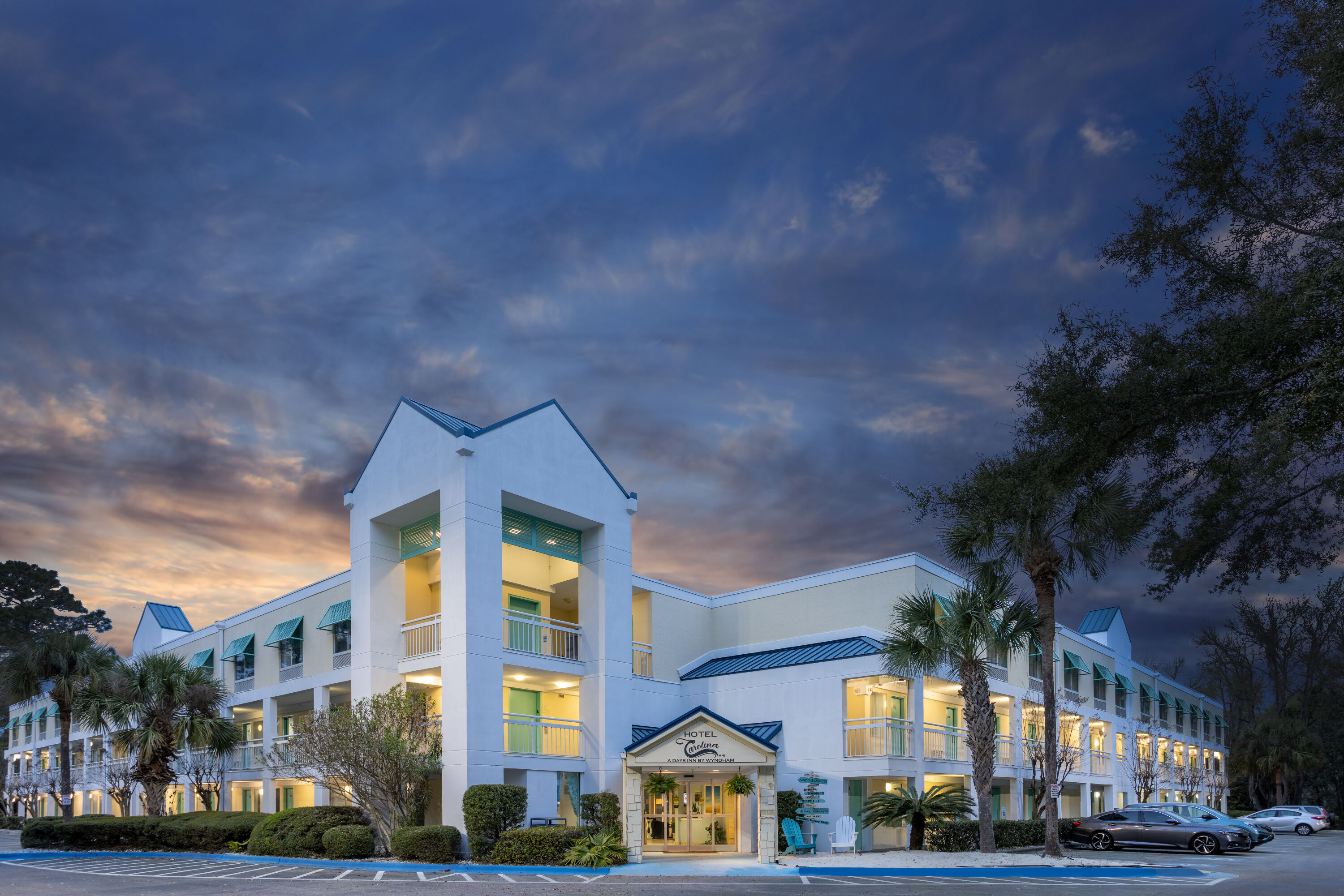 Exterior Dusk Image of Hotel Carolina A Days Inn by Wyndham hotel in Hilton Head, South Carolina