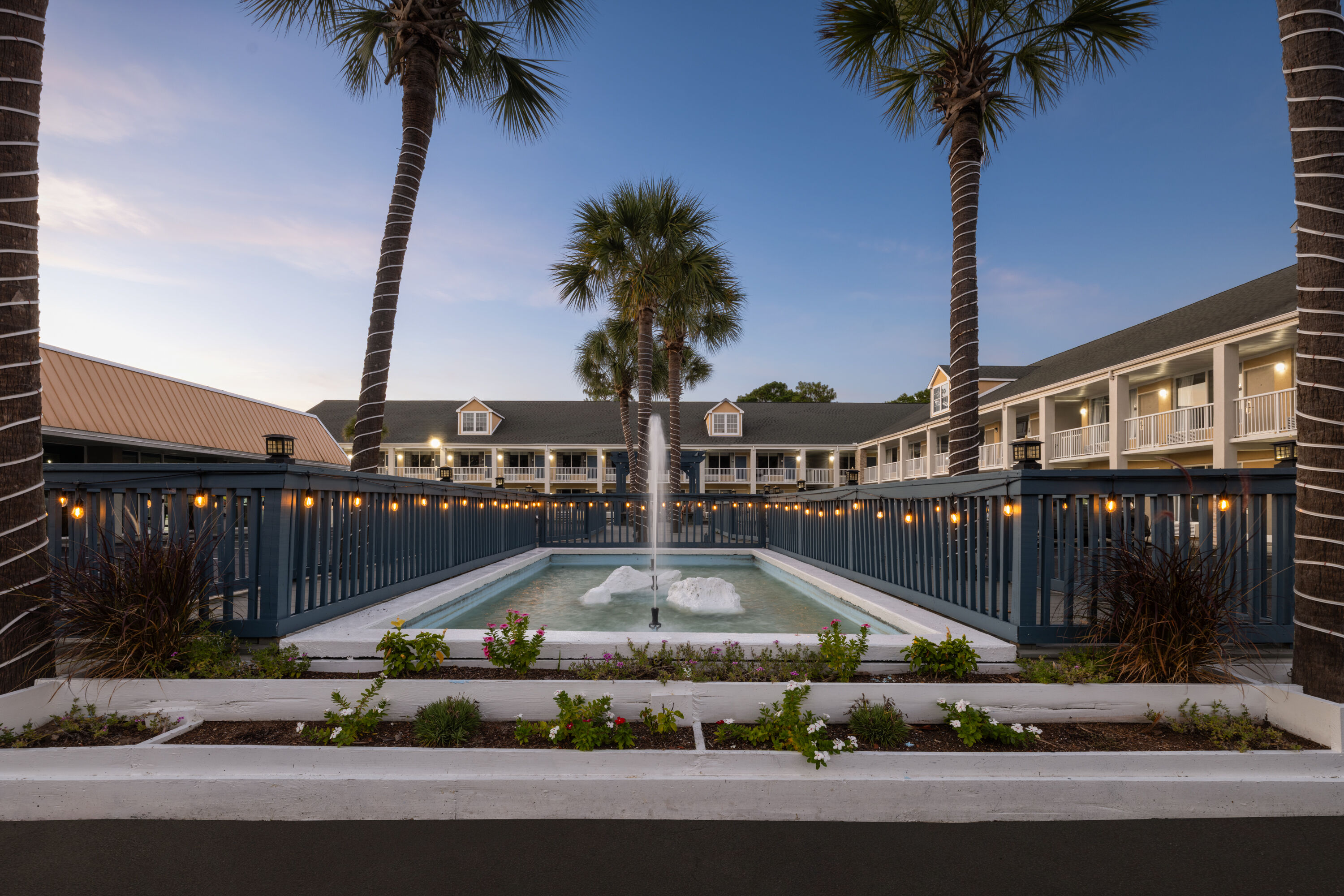 Exterior Dusk Image of Days Inn by Wyndham Pawleys Island hotel in Pawleys Island, South Carolina