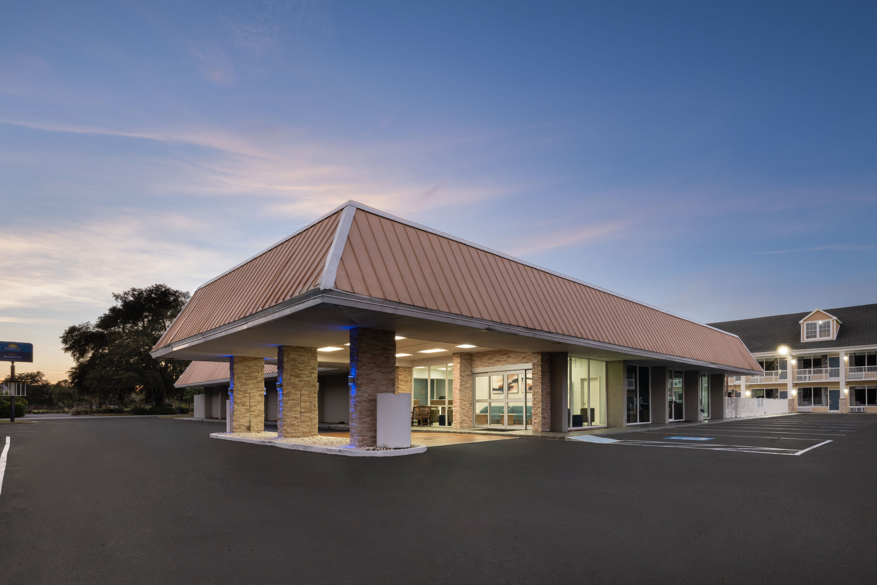 Exterior Dusk Image of Days Inn by Wyndham Pawleys Island hotel in Pawleys Island, South Carolina