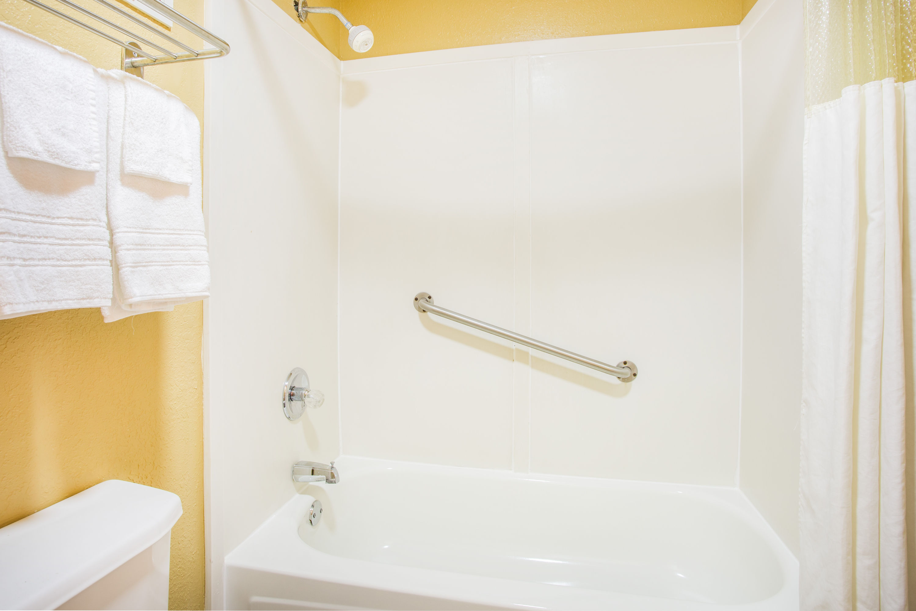 Guest room bath at the Days Inn by Wyndham Athens in Athens, Tennessee