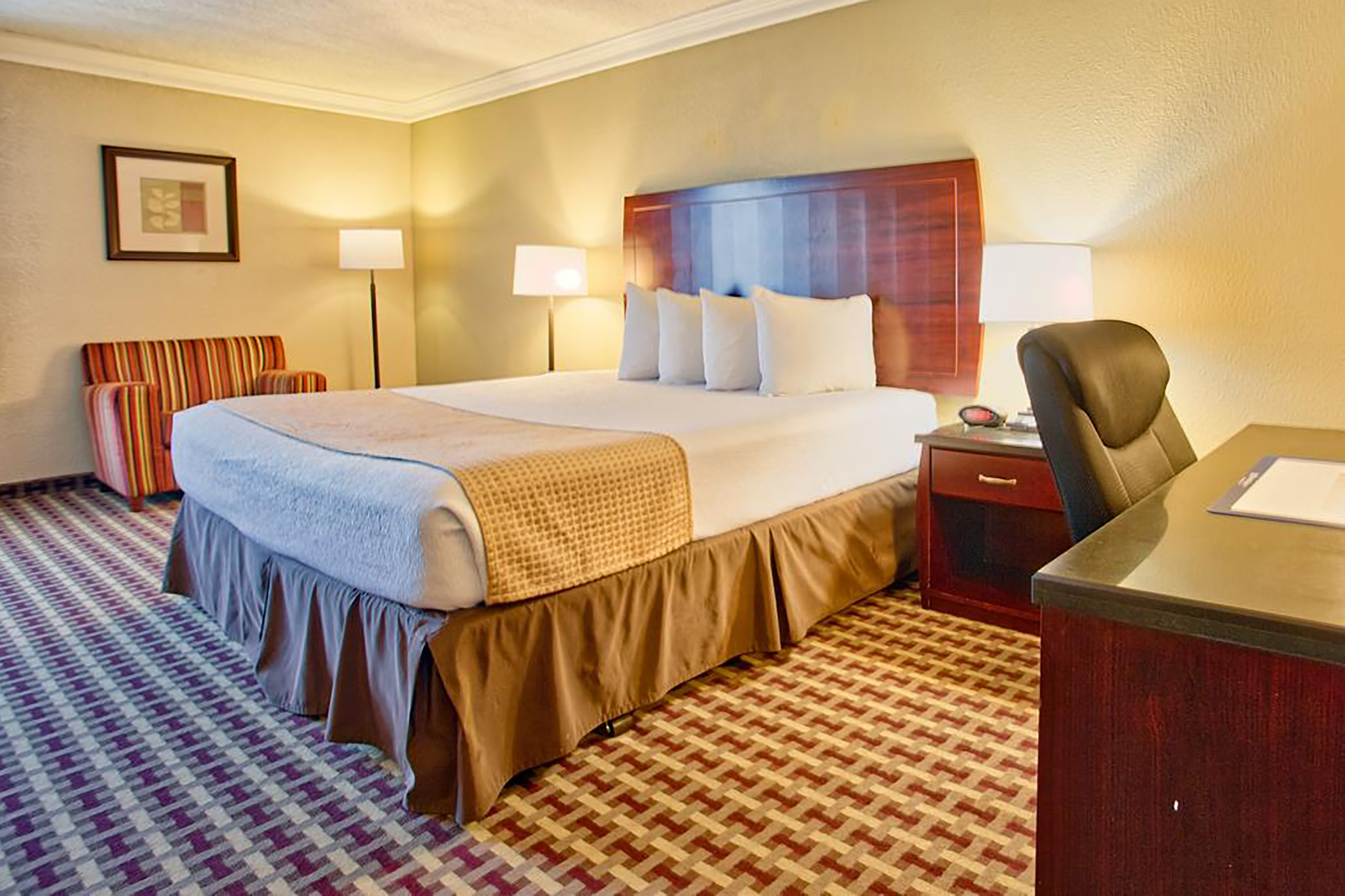 Guest room at the Days Inn & Suites by Wyndham Johnson City in Johnson City, Tennessee