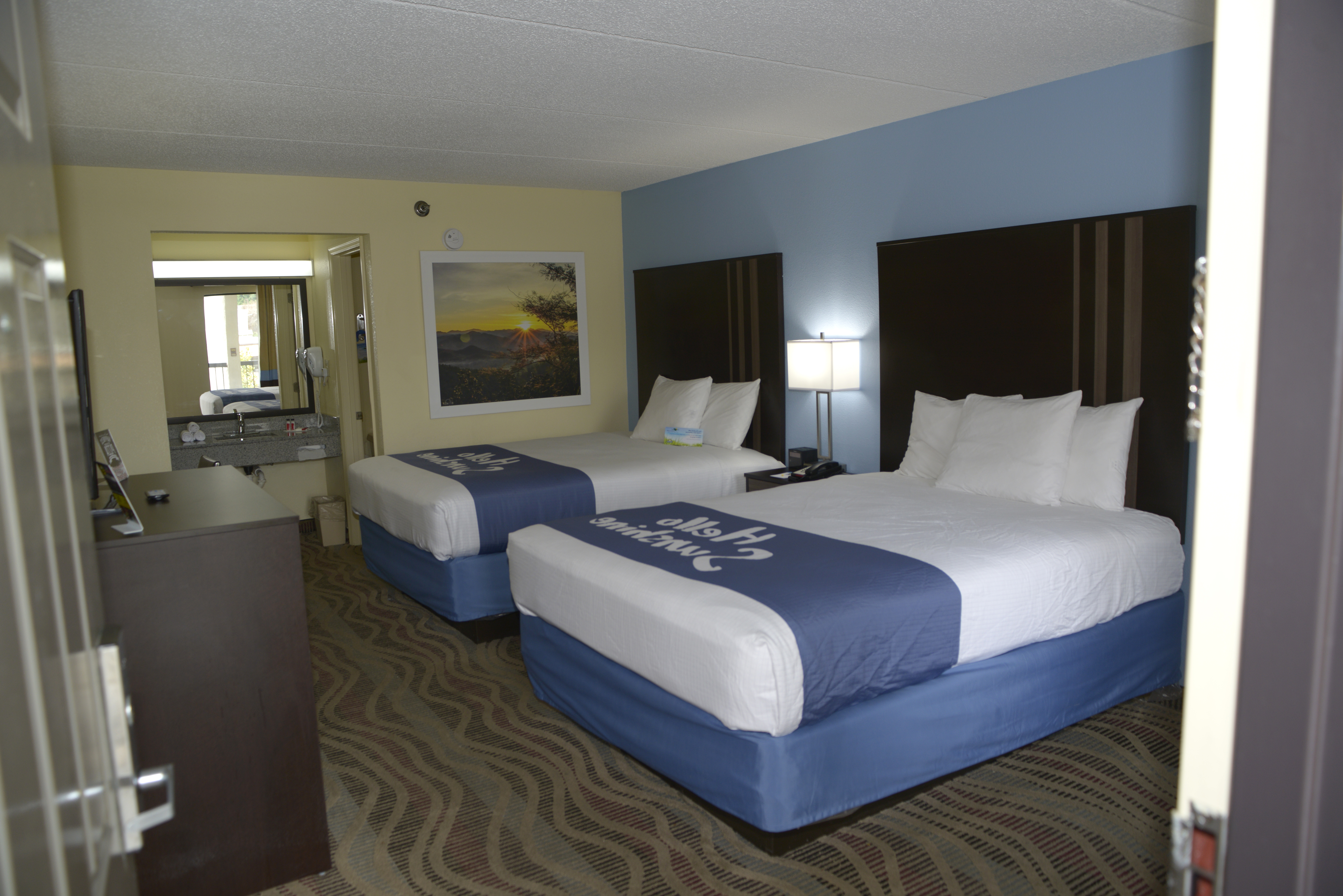 Guest room at the Days Inn by Wyndham Kodak/Sevierville Interstate Smokey Moun in Kodak, Tennessee