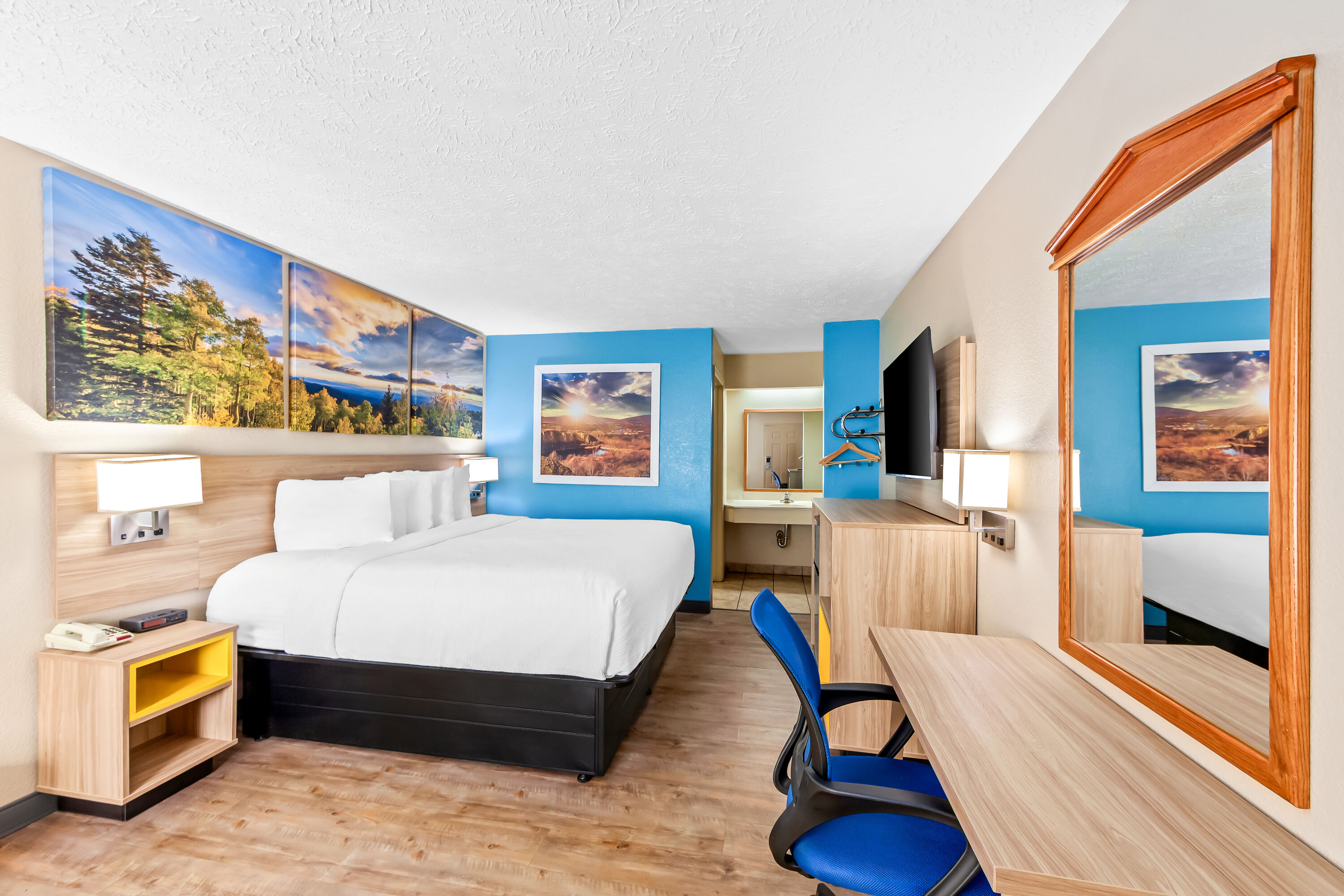 King bed guest room at the Days Inn by Wyndham Lexington in Lexington, Tennessee