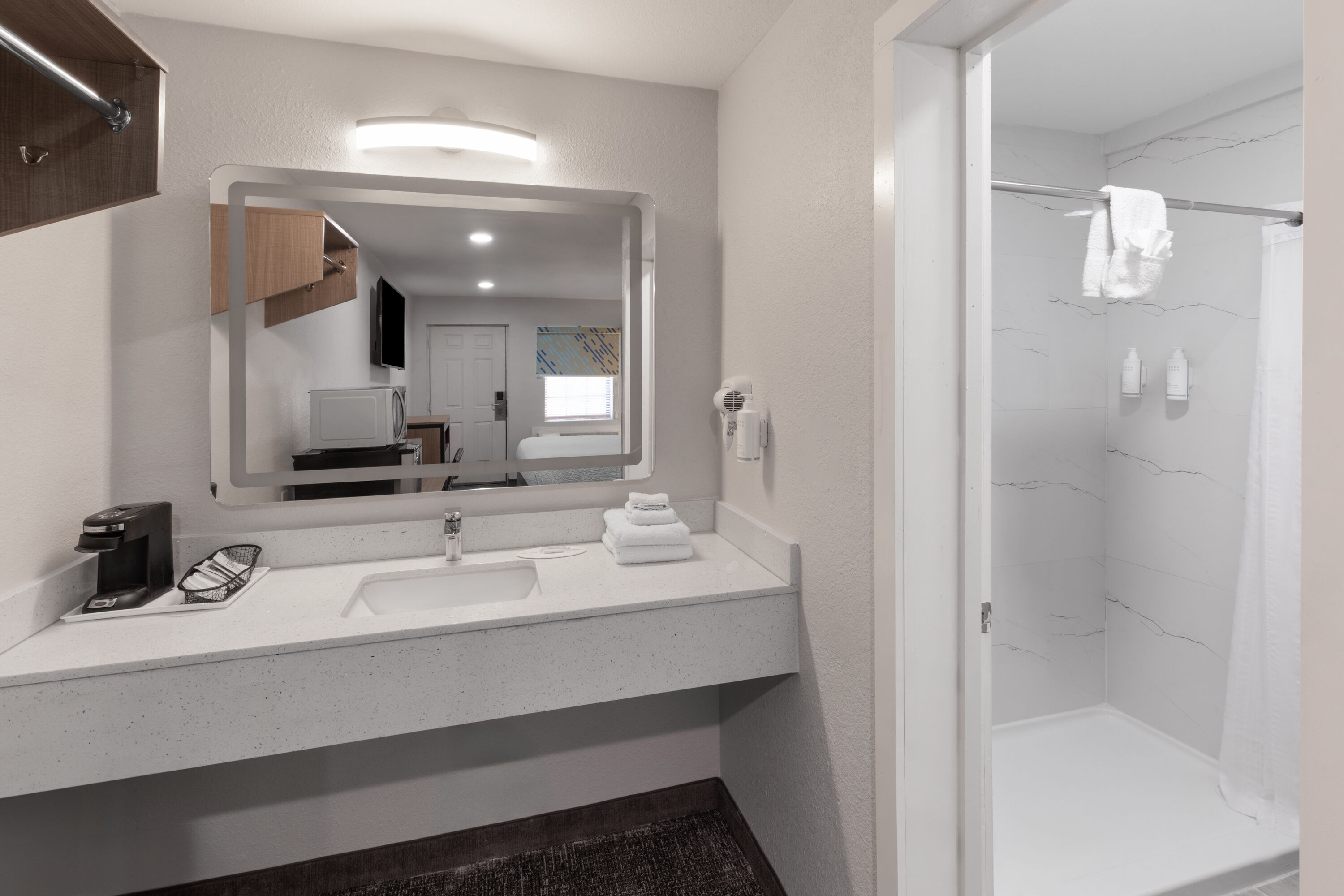 Guest room bath at the Days Inn by Wyndham Aransas Pass in Aransas Pass, Texas