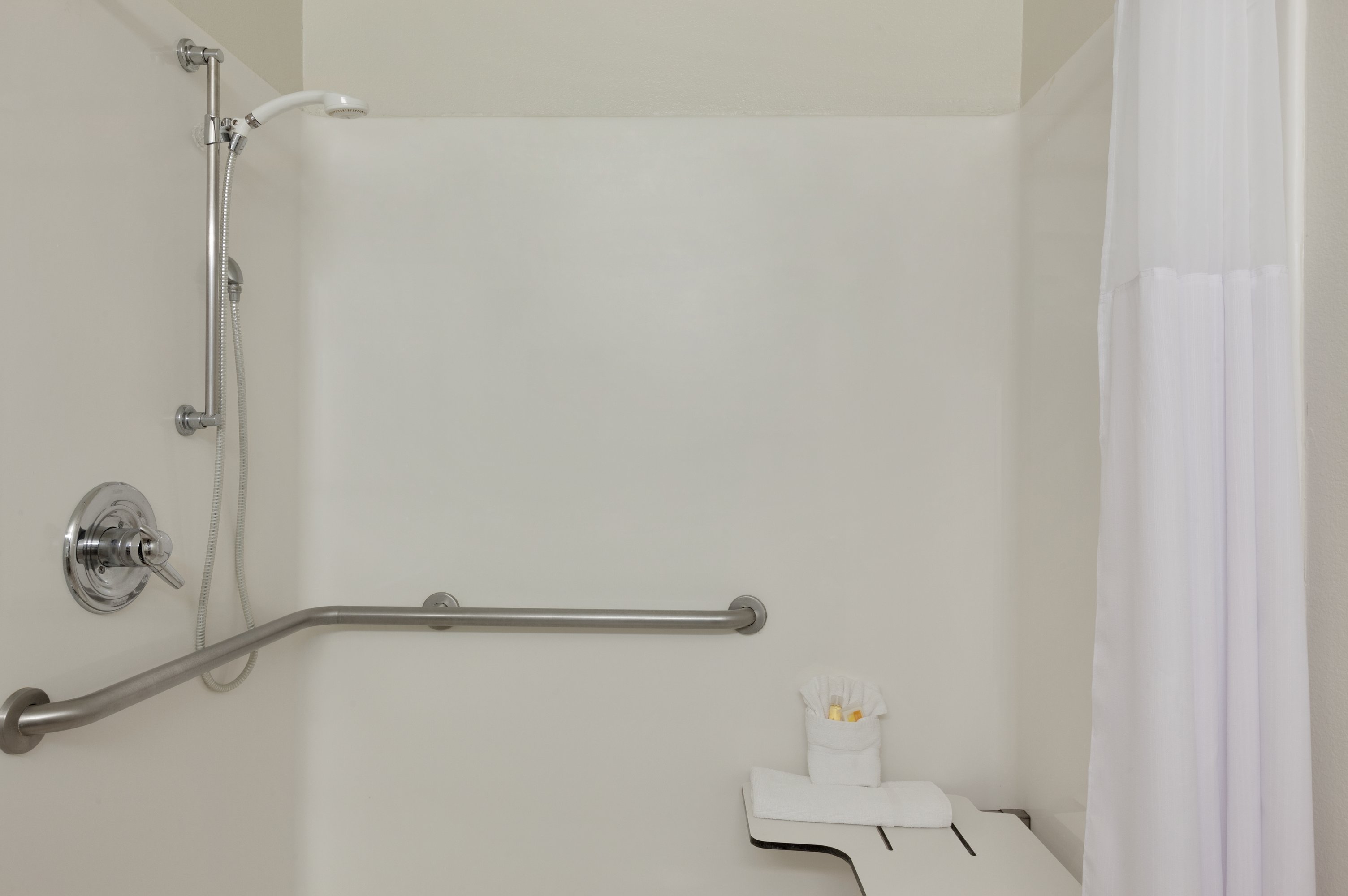 Guest room bath at the Days Inn & Suites by Wyndham Conroe North in Conroe, Texas