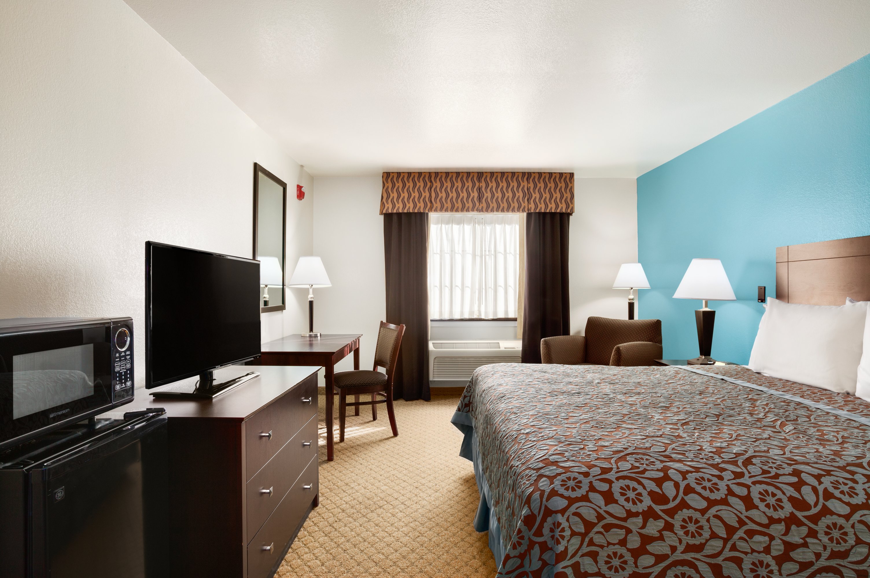 Guest room at the Days Inn & Suites by Wyndham Conroe North in Conroe, Texas